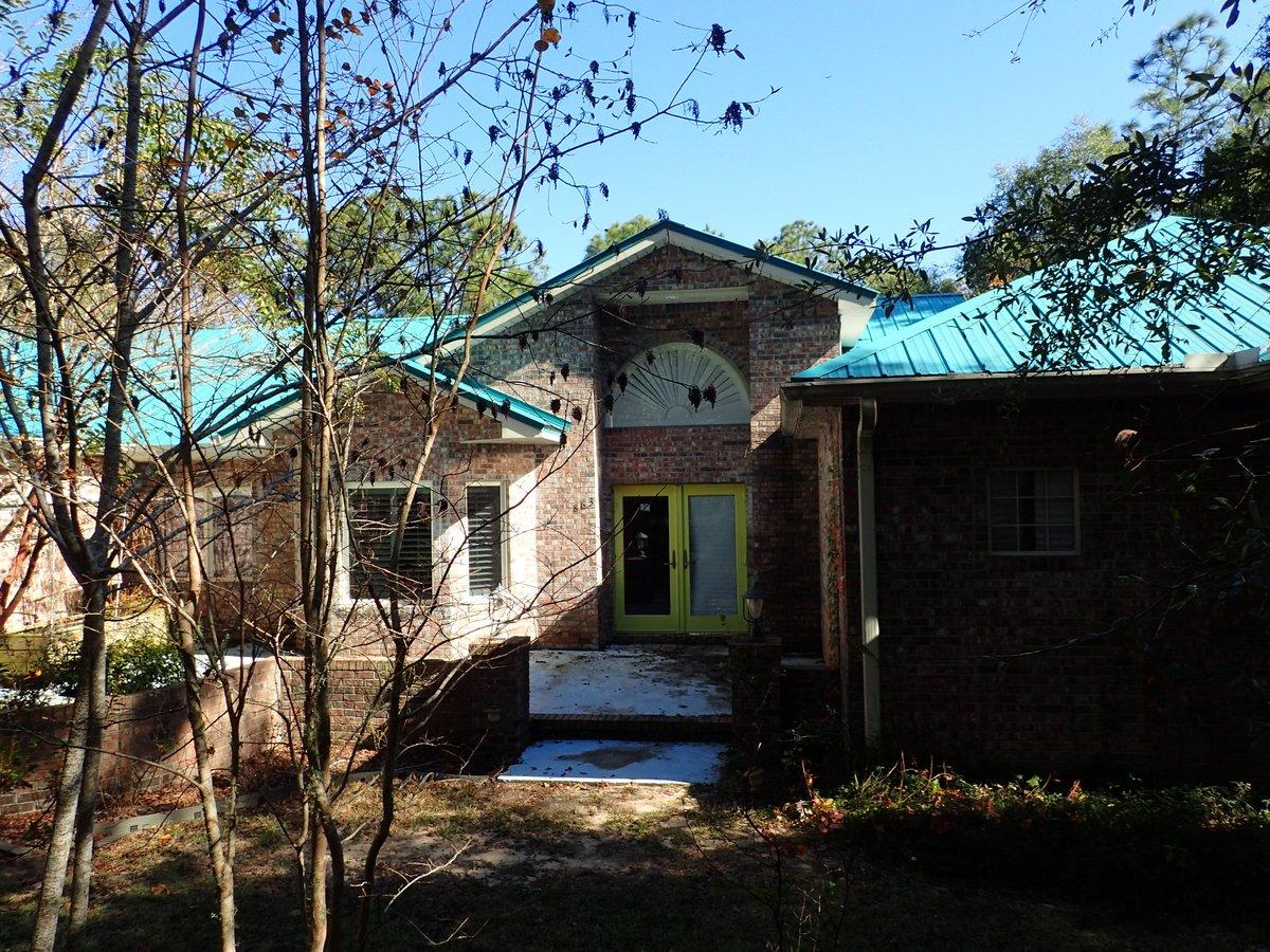 This REO property is pretty amazing. Located just mins from the heart of Defuniak Springs and I10, this 2004 home has all brick exterior, large deck which spans the entire rear of the property and metal roof. 3 bedrooms and 2 baths inside, as well as a 1/2 bath on the side of home for use when working on the over 18 acres this property resides on. Home has a fireplace in the large open living room and a fireplace in the oversized master bedroom. Split bedroom design, this home has tile throughout, large kitchen with cooking island and a very modern contemporary feel. Also there is a huge oversized workshop which makes this home an absolute must see! Call today before this opportunity slips by. Property being sold subject to HUD Guidelines 24 CFR 206.125.