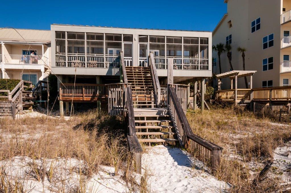 This unique gulf front Duplex in Crystal Beach with 60' of premium gulf frontage is a rare opportunity to own an authentic, Old Florida property that has been lovingly maintained by its owners for more than two generations. This two-story property is designed around an open living space with fully equipped kitchen and floor-to-ceiling windows that invite stunning views inside or out on the private screened porch. The upstairs loft includes a king bed & full bath with tub, and downstairs bunk room has twin beds and full bath with shower. Both units are identical. Other highlights include ample exterior parking, secure storage for beach equipment and outdoor shower. Great for vacation rentals, it generates around $80,000 in rental income with many owner stays. No association fees or H.O.A Crystal Beach was voted one of the top 10 beaches in the world and is located minutes away from world-class fishing, shopping, golf courses and fine dining. This is a duplex both sides are exactly the same. Sea Oats is the rental company and allows guest to use beach chairs and pool.
