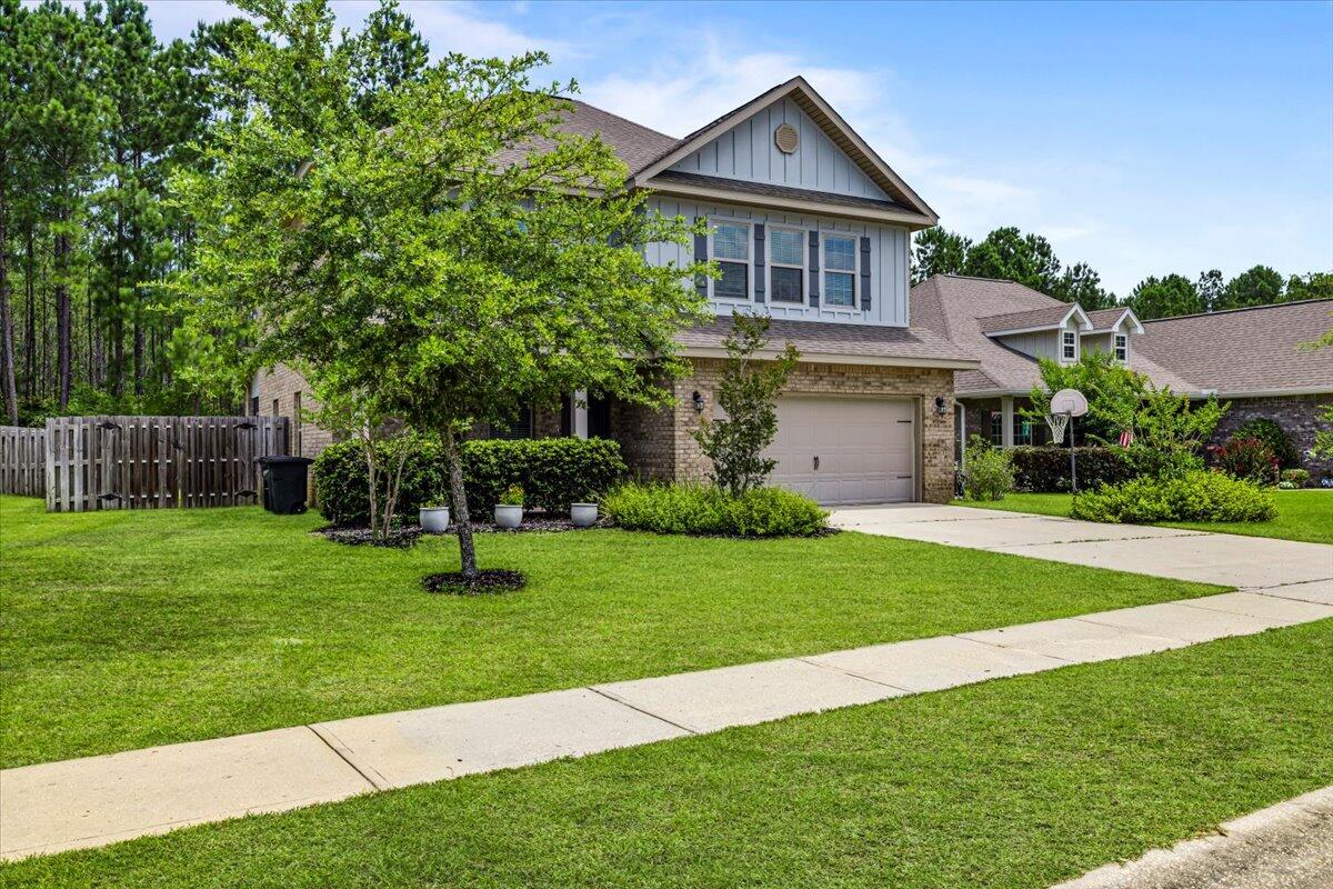 *** PRICED TO SELL****
Perfectly positioned in a no-through traffic street in the Whispers neighborhood, this craftsman style home offers the perfect blend of community living and privacy.  The back of the property spans along a wooded conservation area, providing the homeowner ultimate privacy while still enjoying exclusive access to the community's world class amenities.

This residence's open concept floor plan offers practicality and provides the perfect space for friends and family gatherings. The contemporary designed kitchen is equipped with luxury Cambria quartz countertops, showcasing an extra-large island, a fireclay apron front farmhouse sink, upgraded custom built soft-closing cabinetry and a large walk-in pantry. Also on the first floor, you will find the primary suite featuring elegant crown molding, and a spacious walk-in closet. The master ensuite bathroom offers a 6ft tile walk in shower, and a granite vanity with dual sinks. 

The additional 3 bedrooms are located upstairs, as well as the sizeable flex room, which can be used as an office, a media room or it could be enclosed to create a 5th bedroom, according to your lifestyle's demands.

The home features a wealth of conveniences, including:
An over-sized 2 car garage.  The HVAC has been upgraded with an UV light system, to improve the air-quality of the entire home, in addition to help extend the lifespan of the HVAC system itself.  The first-floor features 22mil, commercial grade LVP flooring. Built to withstand high foot traffic, including a thick underlayment to enhance sound absorbing properties and increase thermal insulation. 
A screened in back porch, facing the backyard. The private and expansive backyard presents the perfect canvas for a luxurious outdoor oasis. It is ideal for creating both recreational and relaxation zones tailored to a high-end lifestyle.

The Hammock Bay neighborhood boasts a variety of on-site amenities.
This full-service development includes a 60-acre sports and recreation park, featuring tennis and pickle ball courts, basketball courts, kids' playgrounds, a newly designed fitness center, 10,00sf club house with an outdoor grilling area, a movie theater, and a resort-style swimming pool complex.  A 30-acre future school site, as well as a town center featuring a brewery, a general store, an amphitheater and the canine commons.
Over 14 miles of bike and hiking paths, situated along 26 lakes for recreational activity, in addition to a lakeside club house, the entire Hammock Bay project sprawls over 3,000 acres.