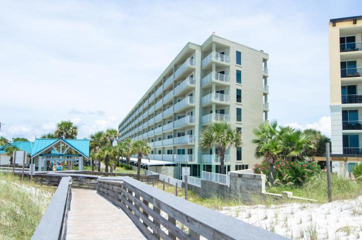 Do not miss your chance to own a gorgeous condo with Gulf views AND one covered assigned parking spot at Seacrest condominium! This condo offers upgrades such as: new hot water heater, tile floor throughout, new drapery, freshly painted, and new washer/dryer! The spacious kitchen is fully stocked and rental equipped with stainless steel appliances. This condo is a turnkey investment you and your family will enjoy for years to come. Enjoy the good life at Seacrest with a sparkling INDOOR/OUTDOOR swimming pool, ample parking, BBQ's, tennis courts, basketball courts, fitness center, - and don't forget the beautiful beach right outside your door.