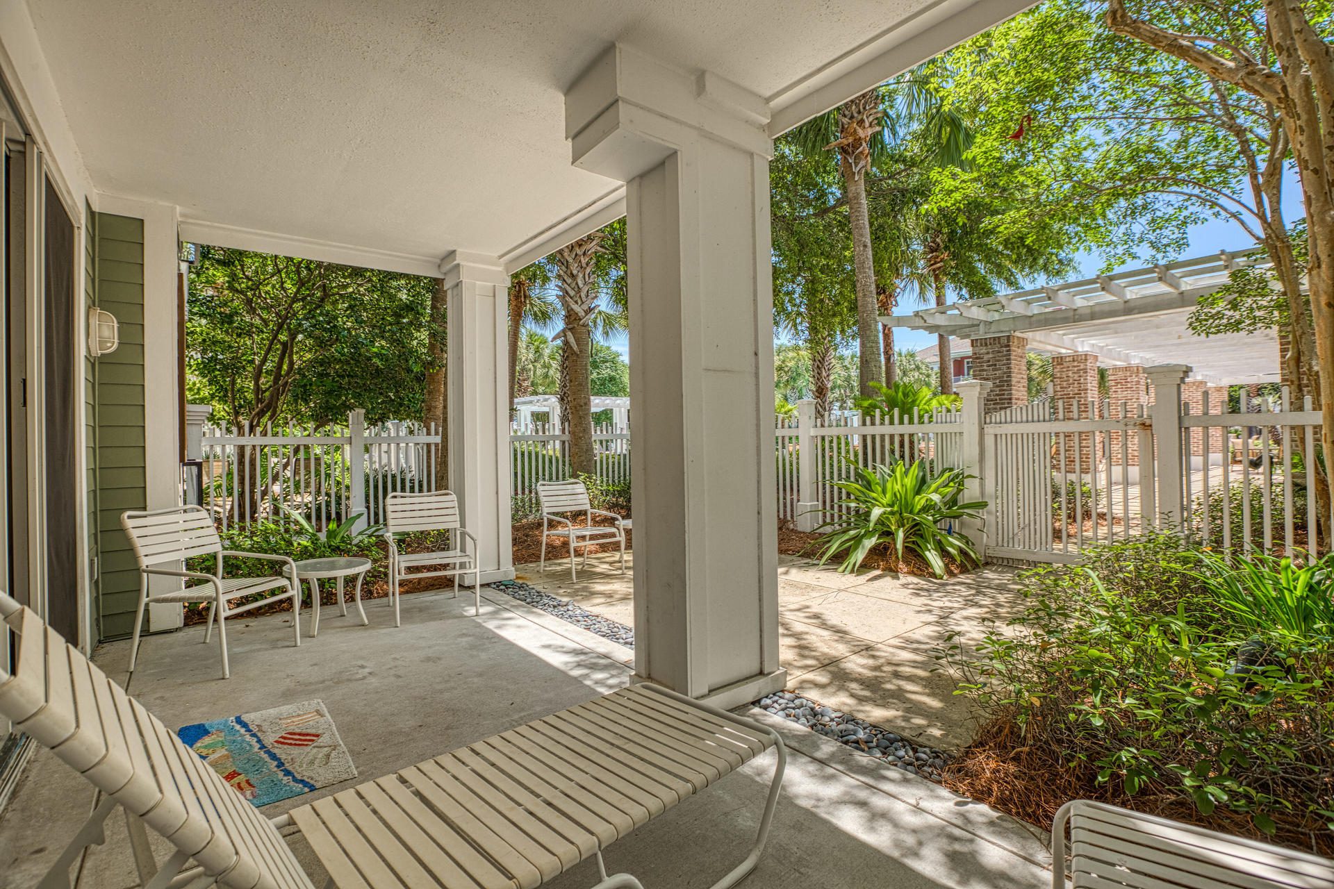 TAKE THE 360 degrees VIRTUAL TOUR...Rare 1BR/BA with LARGE FENCED YARD - directly on the incredible amenities deck. The private fenced patio is twice the size of most and tucked in a great location...close to the lagoon pool but not so close that you feel like anyone can see you!. Step right out the gate to the fitness room and Grill area. A MUST SEE! *none of the wall hanging art is conveying
