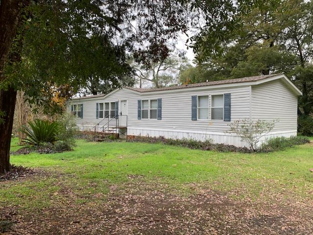 Want a country feel but still close to area amenities? Take a look at this 4/2 mobile home on a beautiful shaded lot in the Choctaw Beach area. This home offers two living areas, spacious kitchen, separate laundry room and split floor plan. Corner lot is level and loaded with beautiful shade trees. There is even an added storage shed for all your gardening tools. Home is in great condition and just waiting for you. Home being sold 'as is'. Buyer to verify anything deemed important including, but not limited to, lot size, room dimensions, sq/ft.