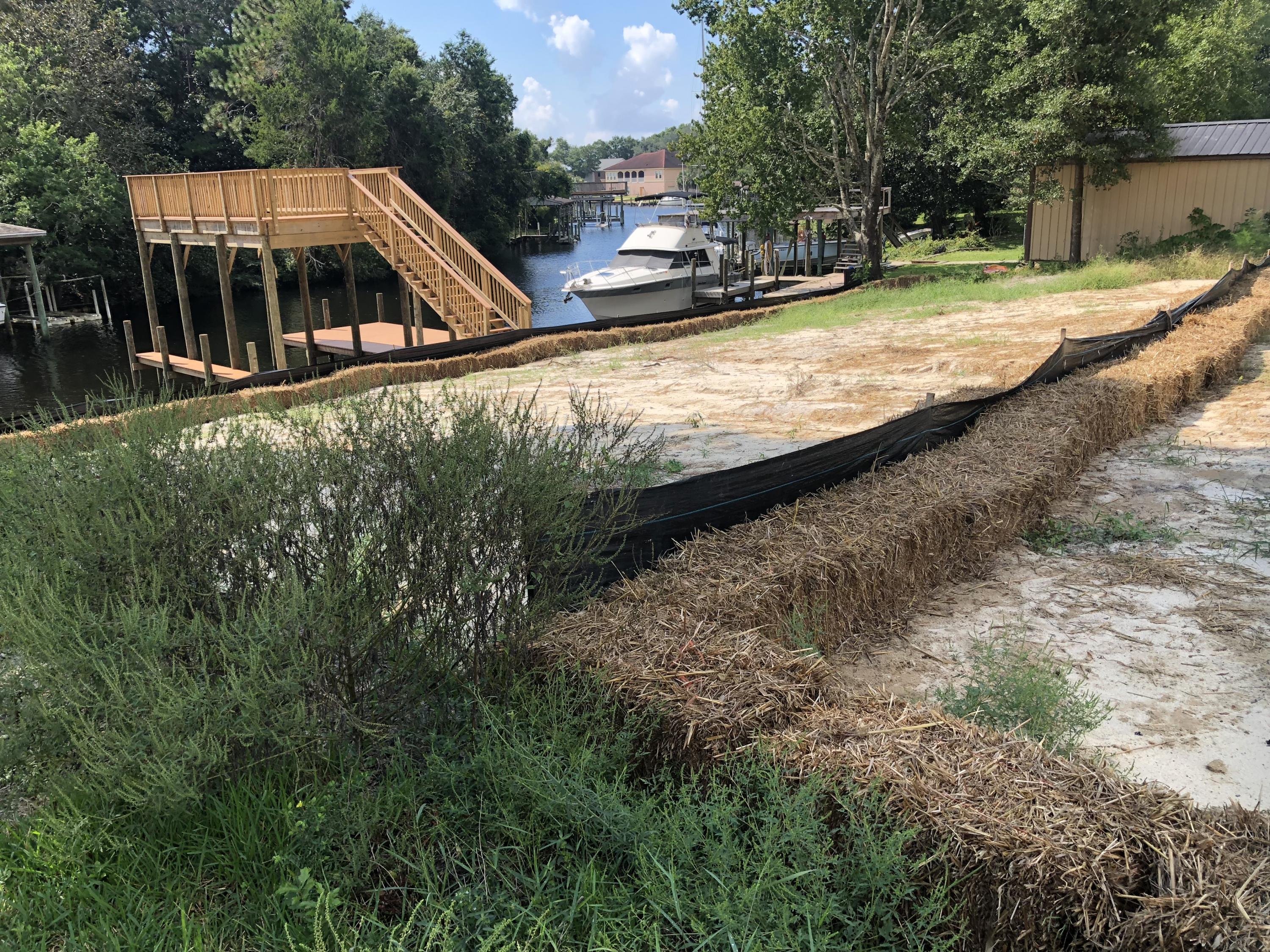 RARE FIND! DEEP WATER canal front .48 acre lot with dock and covered boatslip already cleared and ready to build your dream home! This is one of the last remaining undeveloped waterfront parcels centrally located in Niceville! If you've dreamed of building on the water in one of Northwest Florida's fastest growing and highly sought after communities, this is the chance of a lifetime! The seawall and dock/deck/boatslip were just installed in 2018 and were built with composite material to provide for easy maintenance and built to last! This property will not last !
