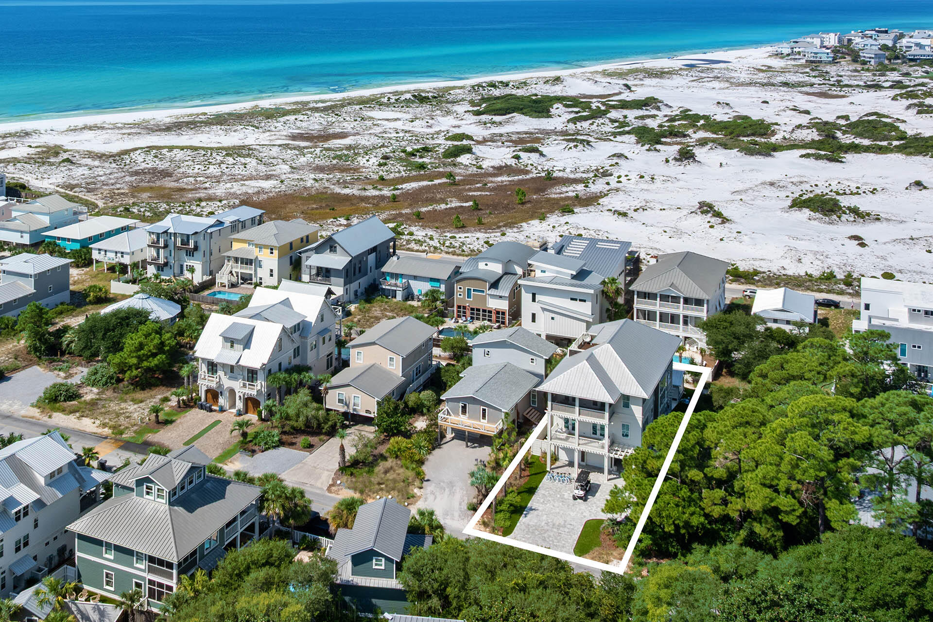 Magnolia Manor invites you to enjoy Grayton Beach. This SMART HOME offers you six-bedrooms, 5.5 baths with high end furnishings and finishes throughout. Just a short walk to the beach you can enjoy sunrise with your coffee or sunset with your cold beverage from the 3rd floor panoramic deck.  The third-floor living area opens to a screened balcony, while the chef's kitchen features Sub-Zero fridges, a Wolf range, dual dishwashers, and a butler's pantry. A private pool, Grill Hut, bonus den, and spacious suites offer comfort and fun. Grayton Beach favorites like The Red Bar and Chiringo are just minutes away, offering lively music and fresh seafood. Just beyond, you'll find shops like Lululemon and art galleries showcasing local talent. Grayton Beach State Park, only a four-minute drive.