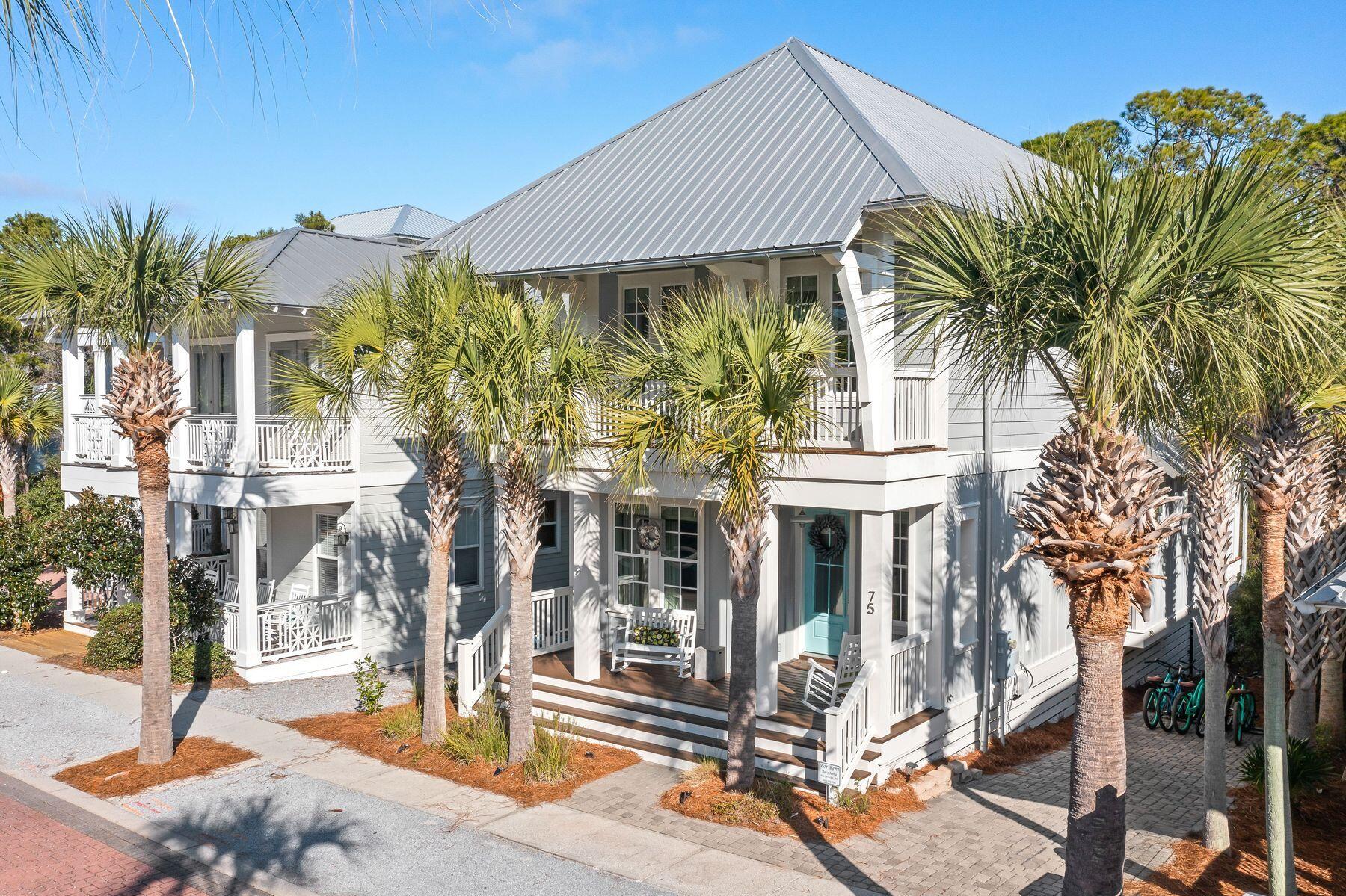 Located on Hwy 30A in Seacrest Beach, this beautifully appointed beach house backs onto natural protected woodland, providing exceptional privacy and serenity. Out front you'll find ample parking and an inviting full-width open porch. Wood flooring, crisp, clean decor, and shiplap detail are evident throughout this attractive home, built to the highest specification with quality furnishings. As you move inside the open concept home, there's a family-sized dining table for mealtimes and card games. The kitchen island has four bar stools, allowing guests to chat with the cook in the well-equipped open kitchen. White cabinets, stainless steel appliances, and Quartz countertops enhance this thoughtful space, which also incorporates a neat coffee bar in the corner. The sitting room is exceptionally light and bright, with an oversized space for gathering. It has multiple windows, recessed spotlights and French doors opening onto a screened porch with outdoor living and a built-in natural gas grill. This serene and private porch looks out onto natural Florida greenery with the chance to spot birds and wildlife. The first level also hosts a guest bedroom and a bath that can be accessed directly from the hall or the bedroom. The generously sized laundry room goes beyond the requisite washer and dryer, including an icemaker and a second refrigerator with a freezer. Head up the oak-tread stairs to the second floor, where the landing has a useful office nook with built-ins. It could easily be furnished as a bunk area for extra guests. A super-spacious guest suite boasts a walk-in closet and a private bathroom with a twin marble vanity and a walk-in shower. The bedroom also has access to a private balcony beneath the overhanging eaves. To the rear of the property, the master suite offers space and privacy with a marble vanity, garden tub and separate walk-in shower in the private bathroom. It has access to another screened balcony, this time overlooking the mature forest. A sliding barn door hides bedroom three, and there's a family bathroom with contemporary tile and a tub/shower combo. There's direct access to the nature trail for those who want to work up an appetite before breakfast. Located at the east end of 30A, this home is within easy reach of the 12,000-sq.-ft. resort pool and deeded beach access is available by bike or via the complimentary tram service. Boutique shopping, dining, and entertainment are plentiful locally and in nearby Rosemary Beach, ensuring every day is filled with activity.