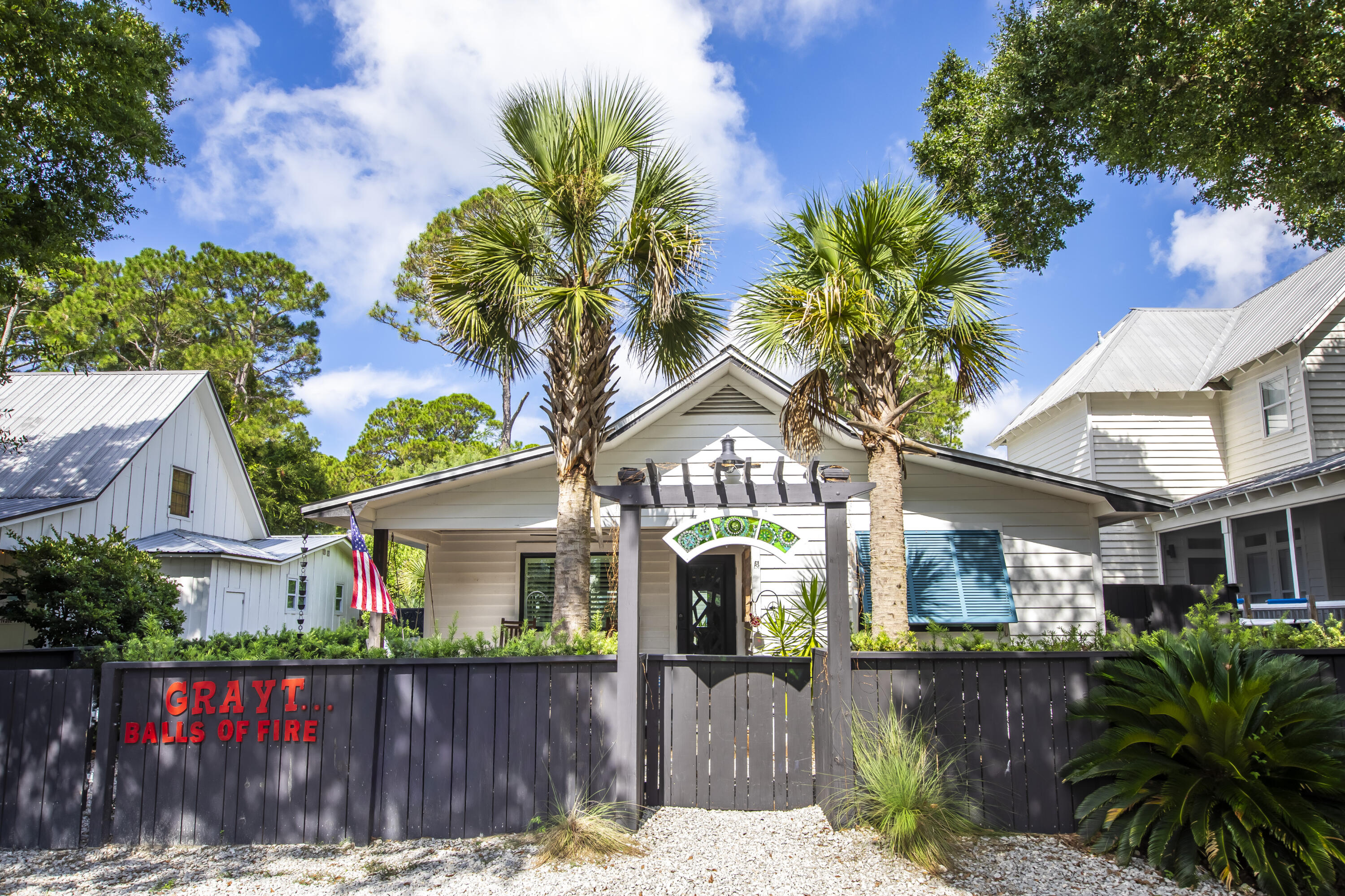 Exuding the authentic spirit of Grayton Beach that few properties have ever emulated, this fully renovated home is a rare blend of Old Florida charm and European sophistication. Tucked beneath native trees and lush tropical landscaping, it offers a true sense of privacy while remaining just a short stroll from the Gulf, renowned restaurants, and Grayton's vibrant artistic shops.

The backyard feels like a private resort, complete with a water fountain feeding into a sparkling pool, tropical plantings, an outdoor fireplace, and multiple covered porches and decks designed for effortless indoor-outdoor living. Inside, natural light floods an open, airy floor plan that includes a spacious living area, 2 primary suites, dining room, and updated kitchen—all perfectly suited for entertaining. Two separate bedroom suites overlook the pool, each with a private bath, creating serene retreats for family and guests.

Recent updates ensure peace of mind, including impact-rated doors and windows, a new roof, and a whole-house natural gas generator. The fenced yard is both pet-friendly and family-ready, with ample parking for up to five vehicles.

24 Magnolia is a modern Grayton classicsophisticated yet inviting, thoughtfully designed for coastal living, and infused with the timeless character that makes Grayton Beach unlike anywhere else.