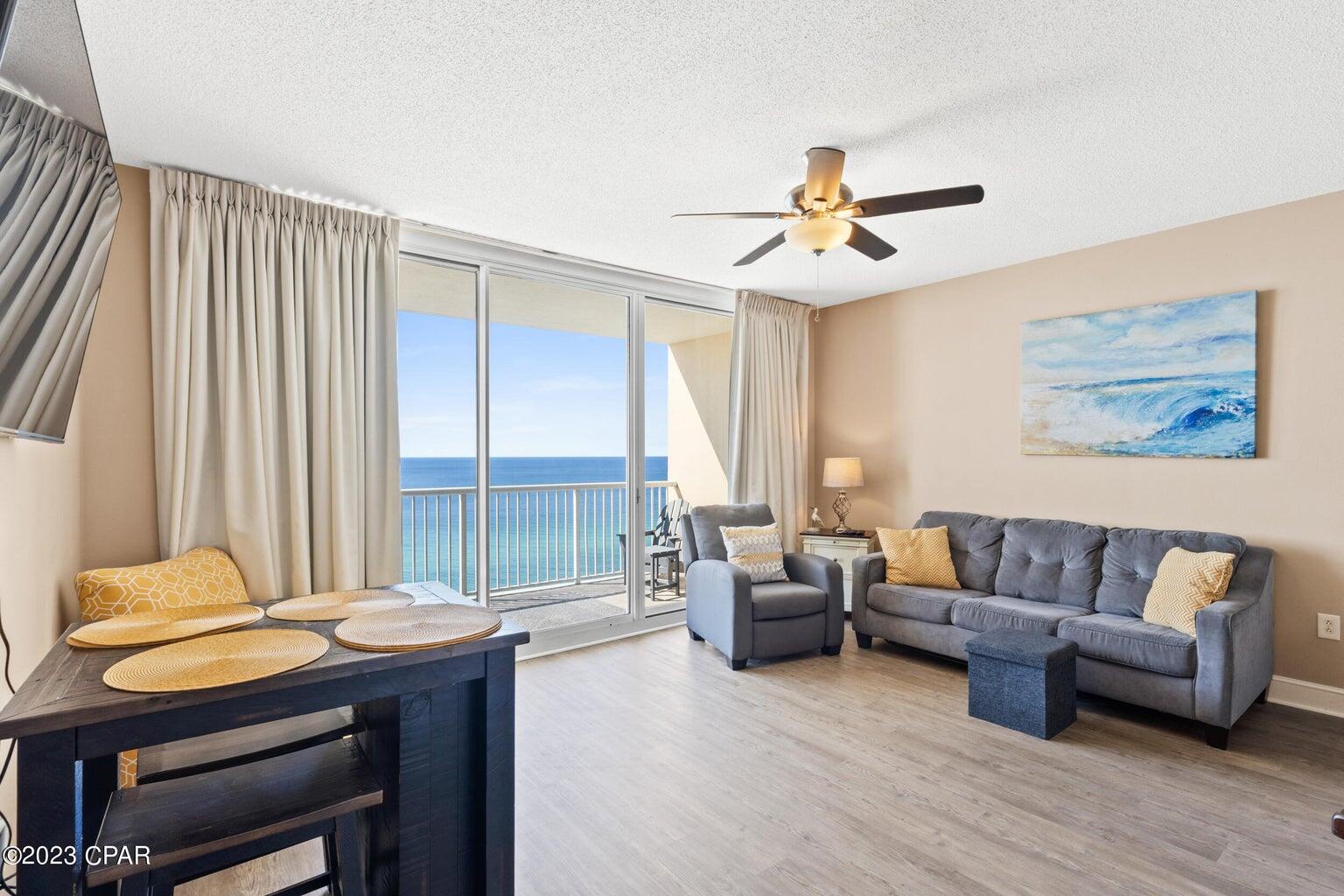 The beach getaway you have always dreamed of - a beach inspired 2/2 Gulf front condo at Majestic Beach Towers. Whether you are ready to live on the beach or invest in a rental property, this is the perfect condo for you! Gorgeous Riveting Gulf views are framed by beachy chic interiors, designed with the Gulf of Mexico and sun in mind. Sunshine and warm gulf breezes abound from the generous balcony, with amazing water and beach views. This fresh, ultra clean, meticulously maintained, turnkey offering has all of the extras and will convey fully furnished, decorated, and rental ready. New Luxury Vinyl Plank flooring throughout makes for super low maintenance. Recent appointments include aforementioned new flooring, new polywood balcony furniture, new front door lock that can be controlled remotely, new front door, and smart thermostat. HVAC replaced '19 and new HWH replaced '22. New refrigerator installed this year in the gourmet kitchen which features loads of cabinet space and is fully stocked and rental ready. The rest of the condo, including both bedrooms lives larger than its square footage and is spacious and bright. EXCELLENT RENTAL INCOME POTENTIAL - '23 YTD gross rental income of over $58k! Fantastic rental history and CTO listed in documents section of the MLS listing. Buyer to have the option to keep Snowbird in place from 2/1 to 2/29 - details available upon request. Enjoy the good life at Majestic Beach with an unparalleled deck of resort style amenities including: 650 linear feet of sugar white GULF FRONTAGE, Four Large outdoor pools (2 at Tower I and 2 at Tower II), Two Indoor heated pools (one in Tower I and one in Tower II), Two hot tubs, Baby pool, Wading pool with waterfall, H20 Bar and Grill serving Gulfside/Poolside lunch and dinner, Large outdoor dining area, State of the Art Fitness center, 130 seat Stadium seating Movie Theatre, Convention center, Private Owner's Lounge with full Kitchen, Tennis Courts, Majestic Market featuring Starbucks coffee. Quick distance to the wonderful shopping, dining and entertainment at Pier Park. FROM THIS CONDO, YOU ARE WITHIN STEPS OF EVERYTHING YOU COULD EVER WANT AT THE BEACH!