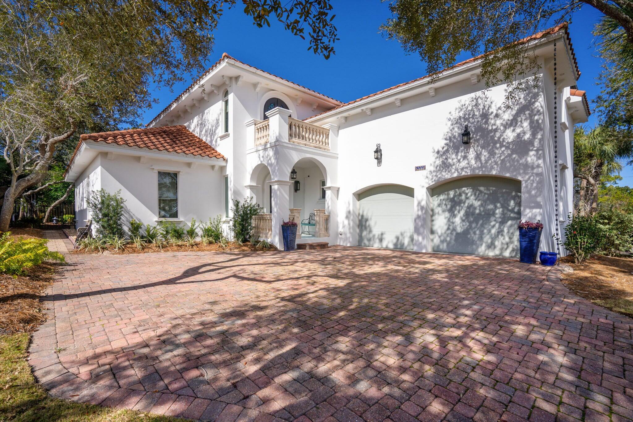 This amazing Mediterranean villa located in  One of Destin's favorite neighborhoods, Destiny West is a gated community situated directly across Scenic 98 from the stunning white sand beaches and sparkling waters of the Emerald Coast! Besides the beach, Destiny's amenities include a clubhouse, fitness center, swimming pool, hot tub, tennis, basketball court and gated access. 
This home provides luxury, conveniences and a practical floorplan well suited to modern lifestyles! Made of ICF construction and located on a cul-de-sac, The primary living area is on the first floor, plus the property offers incredible outdoor living, dining, relaxing, and entertaining spaces surrounding the gorgeous salt-water pool.