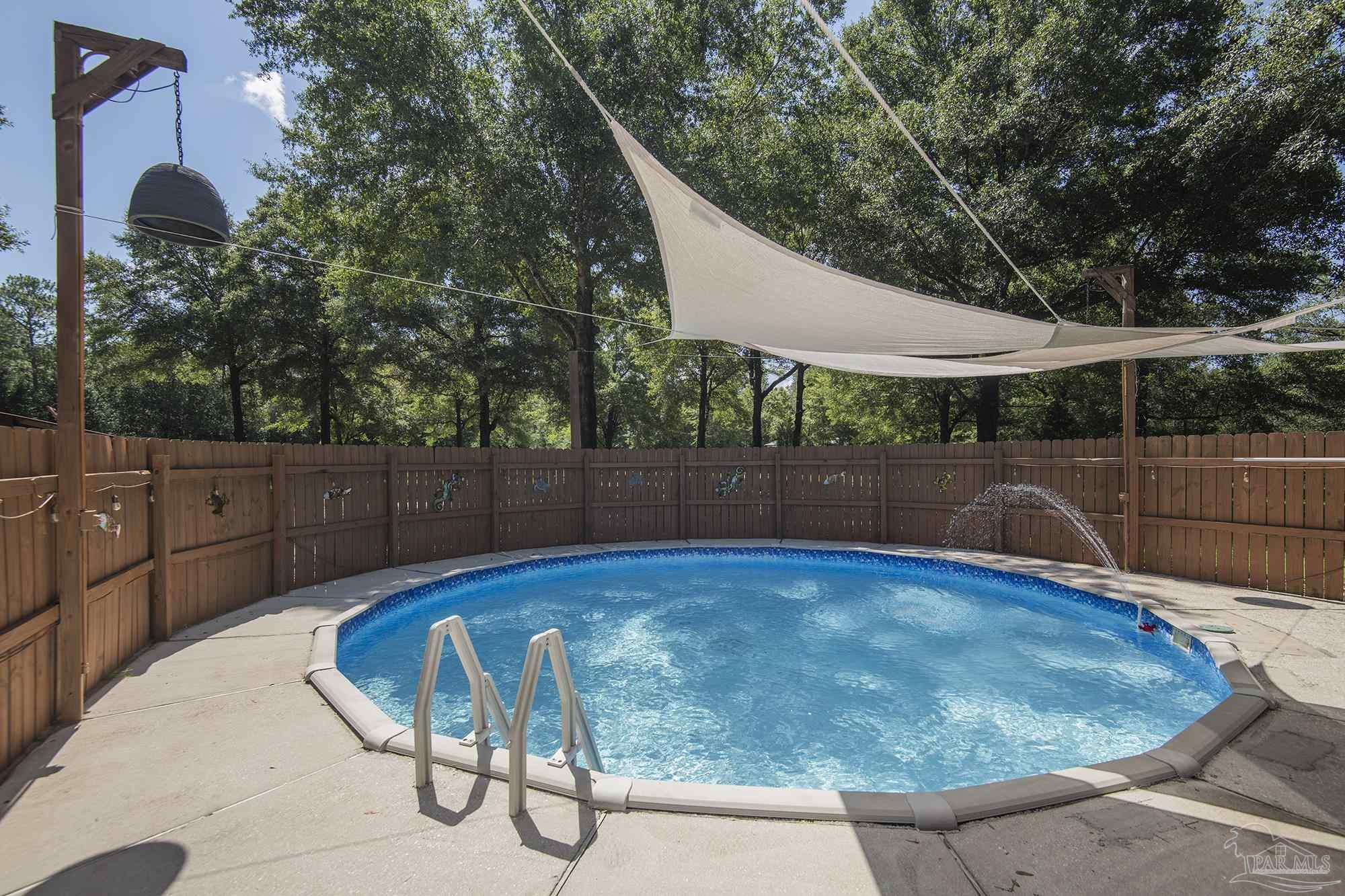 COUNTRY LIVING - this beautiful POOL property boasts 5 ACRES, a massive 2904sqft home, a 1-bed/1-bath 450sqft in-law suite / ADU, a  1050sqft barn, and 2 workshops totalling 1160sqft - both with water/electric! Stepping inside the main house, you are immediately greeted by the open concept living/dining area. The kitchen is a chef's dream, featuring an abundance of storage, updated appliances, and seemingly unlimited counterspace. The master bedroom has more than enough room for a king bed and features a large en-suite bathroom complete with dual vanities, both a soaking tub and walk-in shower, and his-and-hers walk-in closets. The two guest bedrooms both can accommodate queen beds and share an updated bathroom in the hallway. This home features not just 1, but 2 bonus rooms. One of these bonus rooms is suitable as a home office or 4th bedroom. The third is a 450sqft secondary living room or man cave complete with a small office and views of the pool. The fenced back yard provides a secure space for pets and plenty of room for entertaining guests. The garage is massive, with 6 doors allowing access from all sides and built in storage. The pool area outside is perfect for barbecues and lounging in the sun. Located directly next to the main home is a small, detached workshop with electric and power, perfect for any projects you may have. One of the major bonuses of this property is the huge barn with water and electric, perfect for horses or other livestock. Another bonus is the 1 bed/1 bath 450sqft in-law / ADU tucked away in its own private corner of the property. With its own 2-car carport, living room, kitchen, and a full bedroom and bathroom, this would be perfect for family/friends or as a short-term rental! Like the main home, the in-law suite also has a detached workshop with water and electric. Stop on by and see all this property has to offer before someone else does!