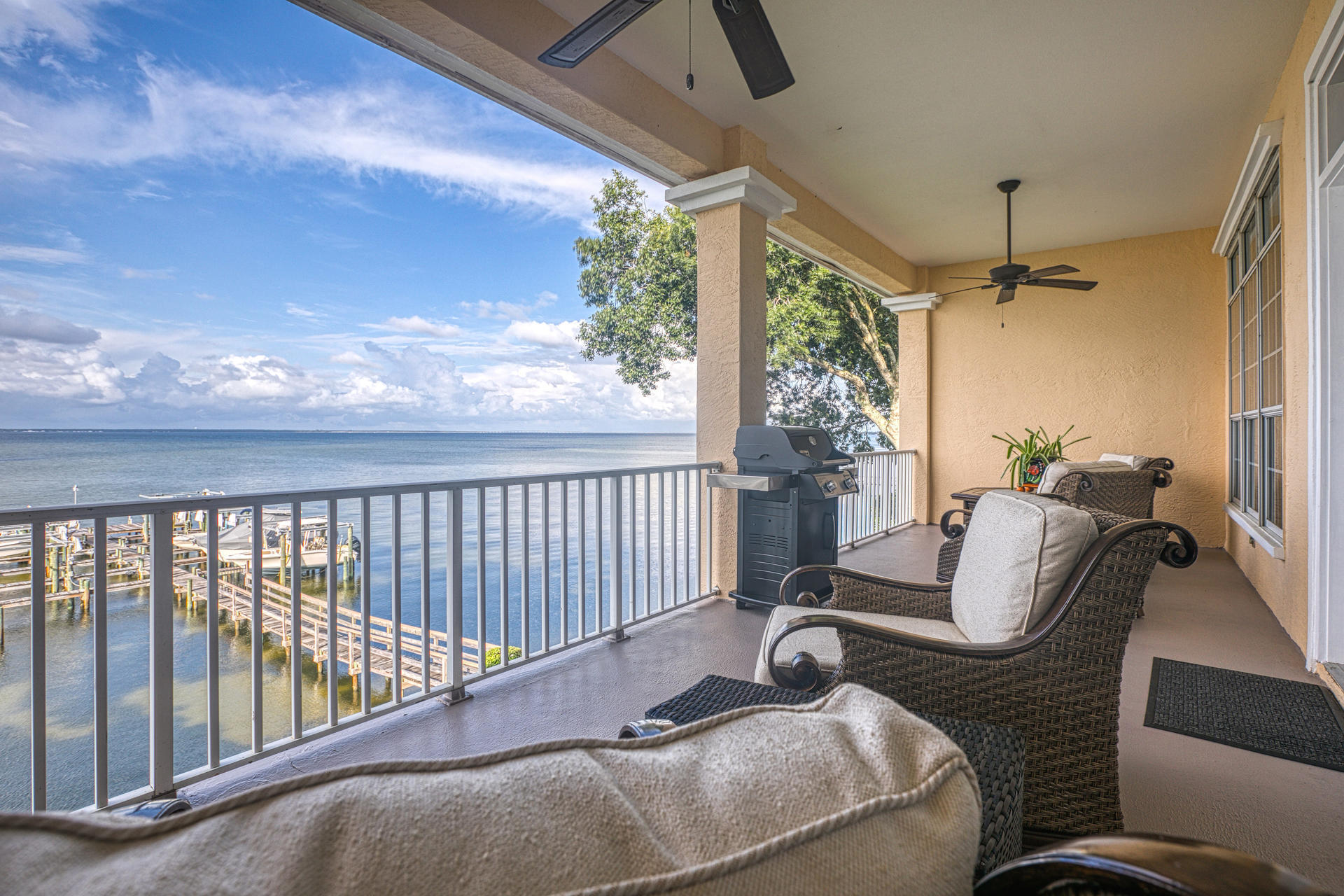 BAYVIEWS AND BOATS!  Rare opportunity to own an affordable, updated condo that includes a BOAT SLIP & BOAT LIFT!  Located on the bayside of Destin, its just a quick ride to Crab Island or continue further south to the Gulf of Mexico.  A Panoramic view of the bay may produce an instant 'wow' response as you open the front door.  Updated kitchen and living rooms reveal a long list of impressive updates including QUARTZITE STONED WALLS and EPOXY-METALIC COATED COUNTER TOPS (you gotta see this. full list in documents). A SOUNDPROOF BARRIER protecting occupants from virtually all neighbor noise has been installed in both living and bedroom walls. 
The highlight of the unit is an oversized patio overlooking stunning views of the bay and large enough to accommodate both a seating and dining areas