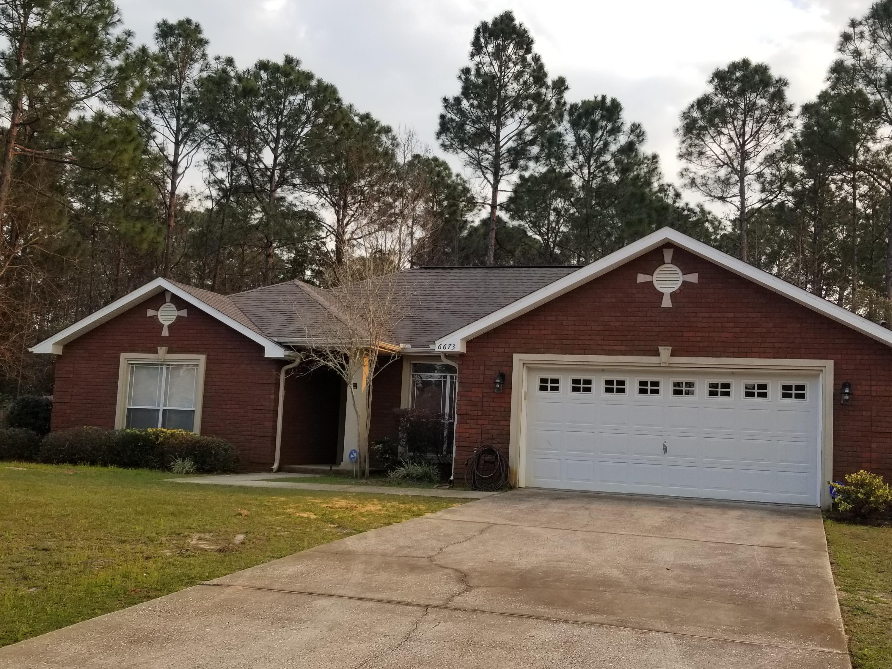 MULTIPLE OFFERS RECEIVED.  Contact your agent for details.  BEAUTIFULLY RENOVATED split floor plan, Craftsman Style home in the coveted Holley By The Sea subdivision.  Updated LVP flooring throughout, fresh interior paint, renovated kitchen and bathrooms with quartz countertops;   root removal of entire yard and new sod in fenced in back yard, with new TREX deck off of the main living area.  Holley By The Sea offers 48-acre park and recreation center with picnic areas along the beaches of the Santa Rosa Sound, camp sites, fitness center, community pools and many other amenities.