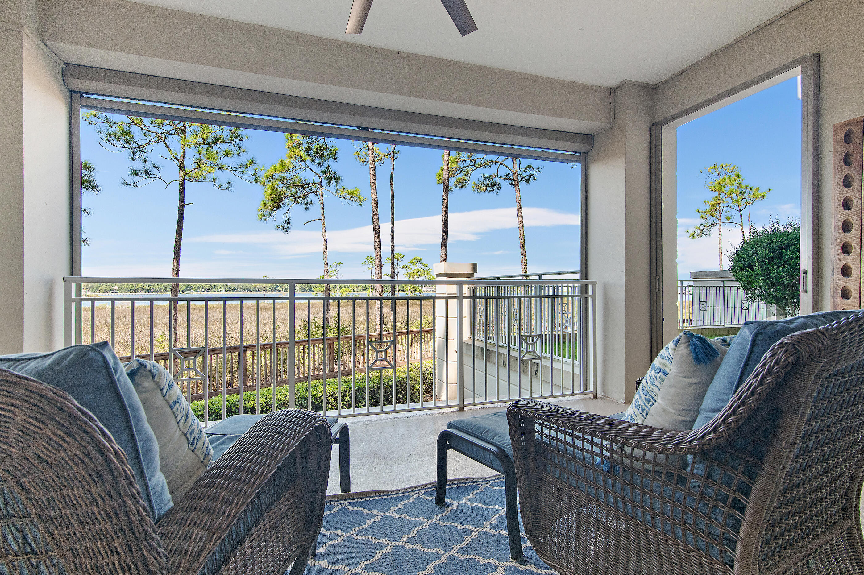 A rare bayfront residence in Sandestin® Resort combines the ease of main-level living with the privacy of a walk-out fenced green space and the convenience of a private garage. Take in panoramic bay views and spectacular year-round sunsets from this end unit that feels like your own private sanctuary. From herons and ospreys to eagles and fish jumping across the water, the wildlife watching is extraordinary- a daily reminder of the natural beauty along the coast. The open, light-filled layout flows seamlessly outdoors, creating an ideal setting for coastal resort living. Step down the walkway to launch a kayak, paddleboard, or fishing line in to Choctawhatchee Bayor simply relax as boats drift by.Anchorage residents enjoy a private pool, while the resort offers a stunning Gulf-front beach, four championship golf courses, tennis and pickleball facilities, scenic nature trailsand a full-service marina. Within minutes by bike, golf cart, or a short walk, explore premier dining, boutique shopping, and live entertainment at both The Village of Baytowne Wharf and Grand Boulevard.
Ideal as a primary home or second residence, this bayfront property blends convenience, recreation, and the coastal lifestyle in one of the most desirable resort communities along the Emerald Coast.