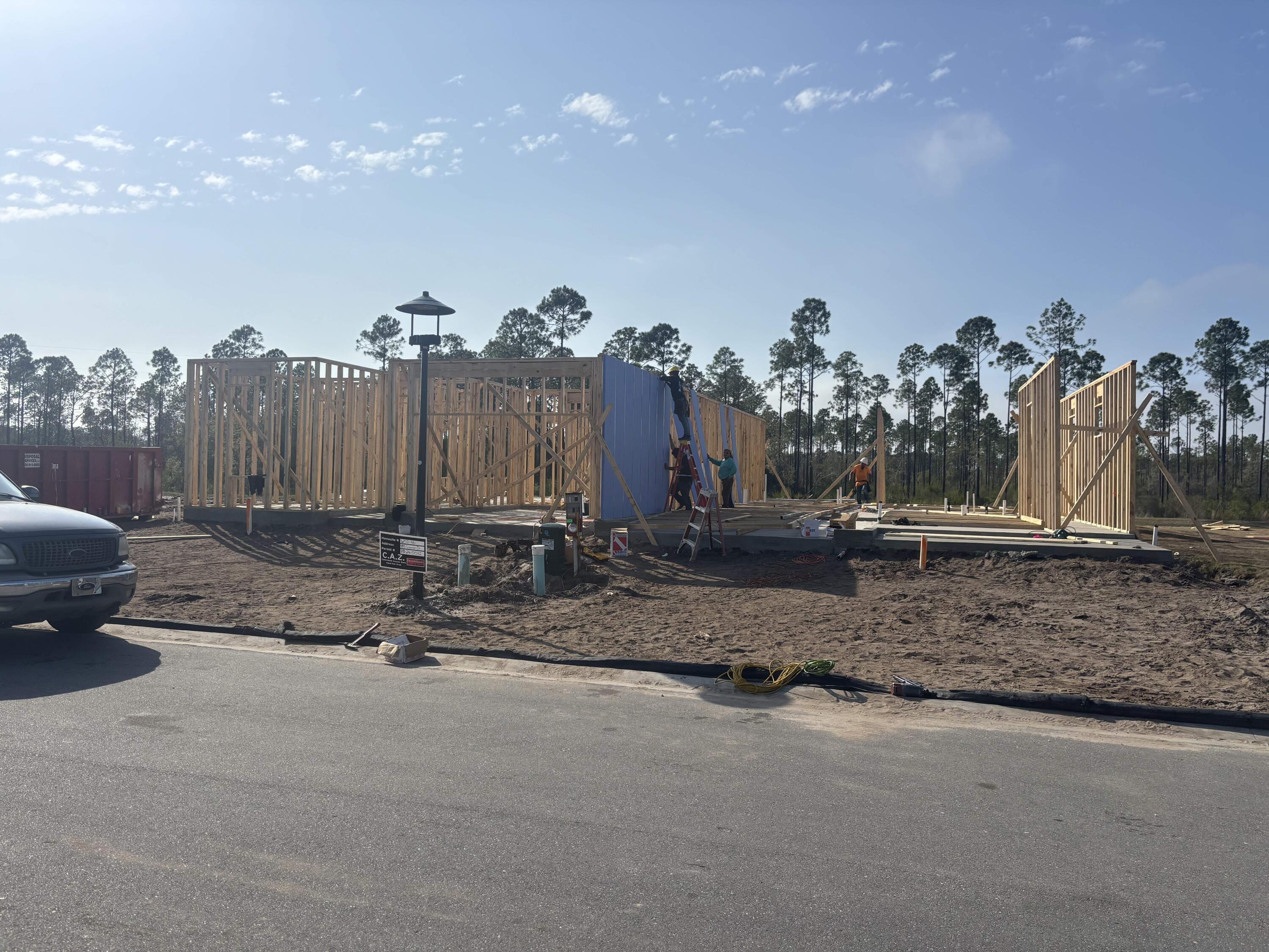 Construction has started and we're in framing! Enjoy serene views and effortless living in this Anfield paired patio villa by Fischer Homes, located in Long Leaf Park Villas at Watersound Origins. This thoughtfully designed single-level home offers 2 bedrooms and 2 full baths, positioned to capture peaceful wooded and dry pond views for added privacy.

With 10-foot ceilings and a bright, open layout, the kitchen and family room connect seamlessly to the covered rear patio--creating a natural extension of the living space.

The upgraded kitchen features quartz countertops, a farmhouse sink, enhanced cabinetry, a stainless canopy range hood, and a spacious walk-in pantry. With the powder room option located just off the Family Room, functionality is enhanced for guests and entertaining. Luxury vinyl flooring runs throughout the home, while both full baths showcase tile extended to the ceiling for a clean, elevated finish.

The Owner's Suite includes the Luxury Bath Suite and a generous walk-in closet, offering a comfortable retreat.

An installed Smart Home security package with remote access capabilities adds everyday convenience and peace of mind.

Enjoy low-maintenance living with HOA-covered lawn care and exterior upkeep, giving you more time to experience the exceptional amenities of Watersound Origins. Indulge in the Origins Golf Course, relax at the resort-style pool at Village Commons, enjoy sports courts and miles of trailsall within this vibrant, amenity-rich community.

This is your opportunity to embrace easy living in one of South Walton's most desirable neighborhoods. Schedule your tour today!