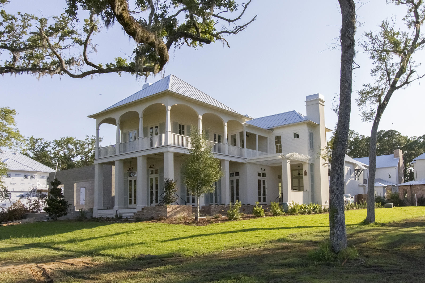 Incredible Low Country style custom home that continues the tradition of amazing architecture in Churchill Oaks. Located on the best interior lot in Churchill Oaks with forever bay views, 46 Bennett has every amenity you desire from generous outdoor living, a louvered lanai, outdoor fireplace, a 2nd floor sleeping porch, and fiber optic internet service. The open interior floor plan features the finest fixtures and finishes available, white oak floors throughout living and bedrooms, marble baths, and spectacular views from every room. Churchill Oaks is the perfect place for families to gather, interact, and call home. Schedule your appointment today to view this former Parade of Homes winner!