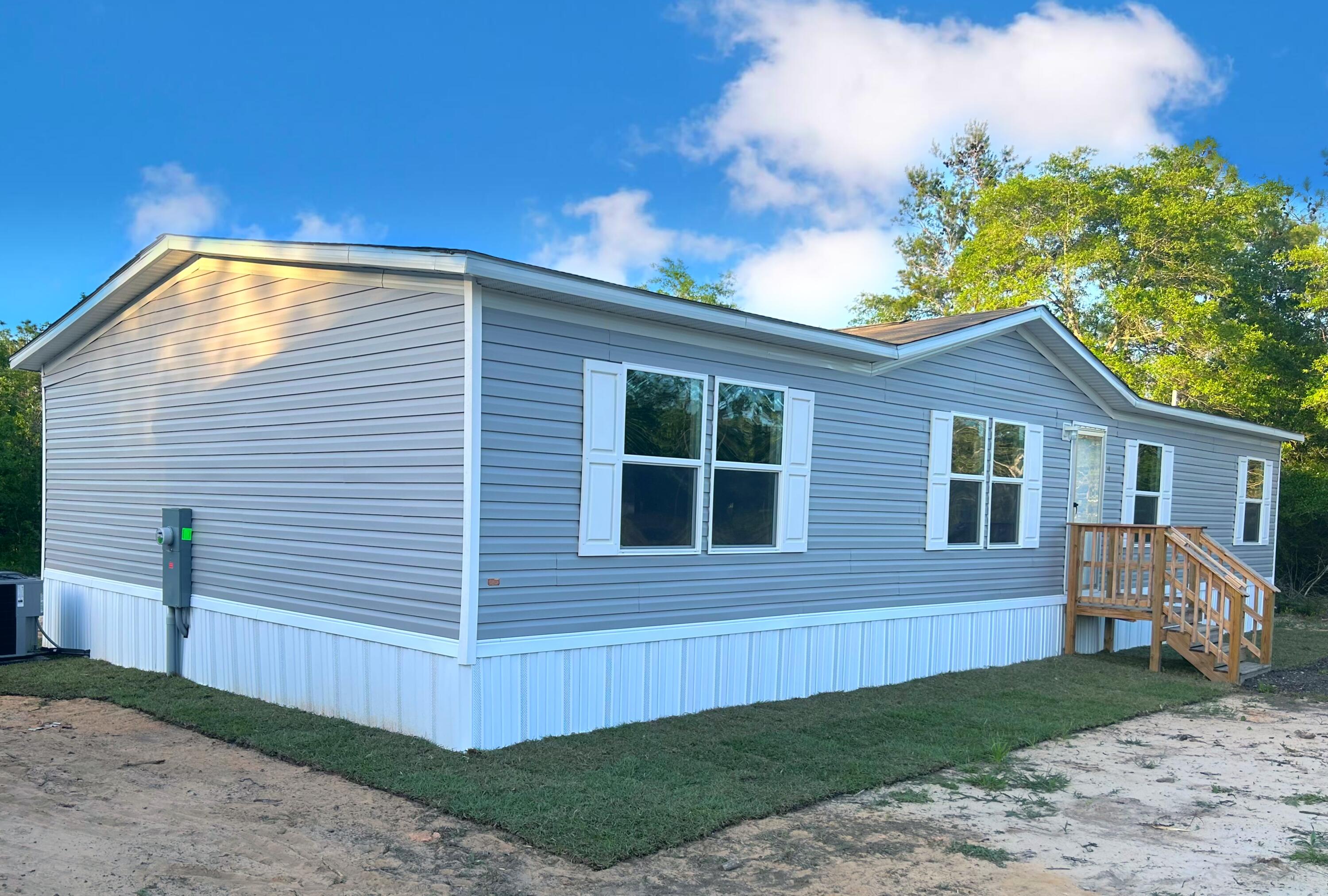 *Seller is offering a $5,000 credit to buyer with a full price offer* This Brand NEW 4 bedroom 2 bath home is almost MOVE IN READY. It's open floor plan has beautiful wall to wall vinyl flooring throughout. This home is  ENERGY EFFICIENT with OSB Wrap with House Wrap, Lux Low E Thermo-Pane Windows that fold down for easy cleaning & maintenance. 5 year homebuyer protection plan in place at the time of a successful closing. You will have about a 15 minute drive to historic downtown DeFuniak Springs and an hour drive to the beautiful white sandy beaches of South Walton, and 20 minute drive to Crestview. Give us a call to schedule your showing. Check out the virtual tour uploaded with the photos. Staged photos and virtual tour are of the model home and may have a few different features.