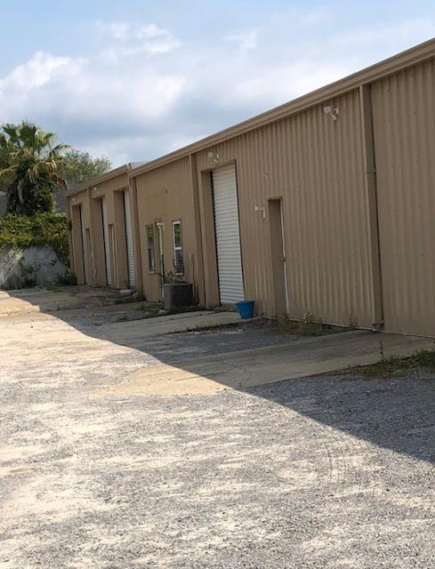 4228 SF Industrial Free Standing Building, located in the heart of Destin, conveniently located right off of Hwy 98, 4 ground level rollup doors, possibility to subdivide.