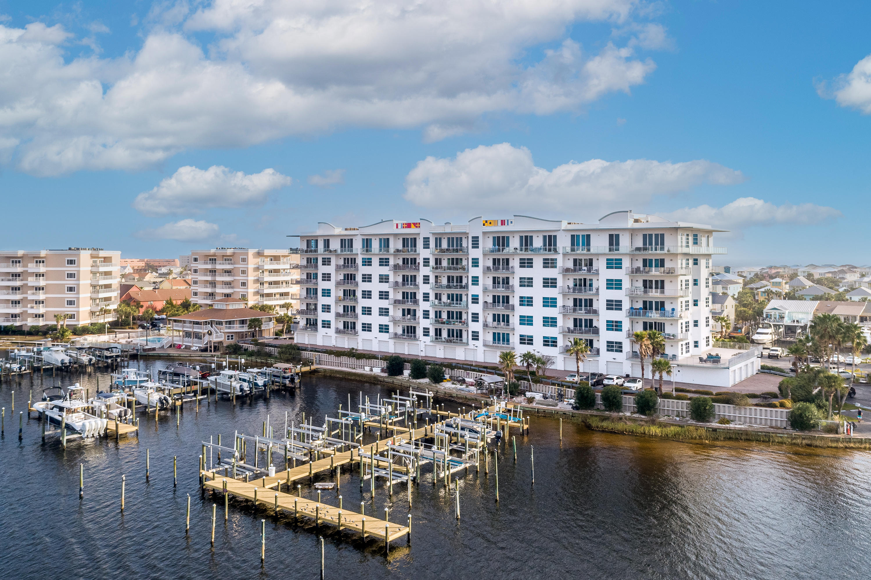 Luxury on the Harbor. Welcome to Harbor Lights, Residence 211. This condo has been completely renovated starting with beautifully designed kitchen that includes the exquisite granite counter tops, cabinets and stainless steel appliances. No expense was spared when creating the Master Suite experience starting with his and hers custom vanity sinks, glass shower and soaking tub. Start every morning with Harbor views from your Master Suite. The residence also offers one of the biggest patios in the area which is perfect for entertaining and enjoying picturesque views of the Harbor and the Destin Waterways. All bedrooms feature en suite. The residence has a private garage and storage closet. The complex offers a pool, fitness center, community room, gated entrance and access control entry.