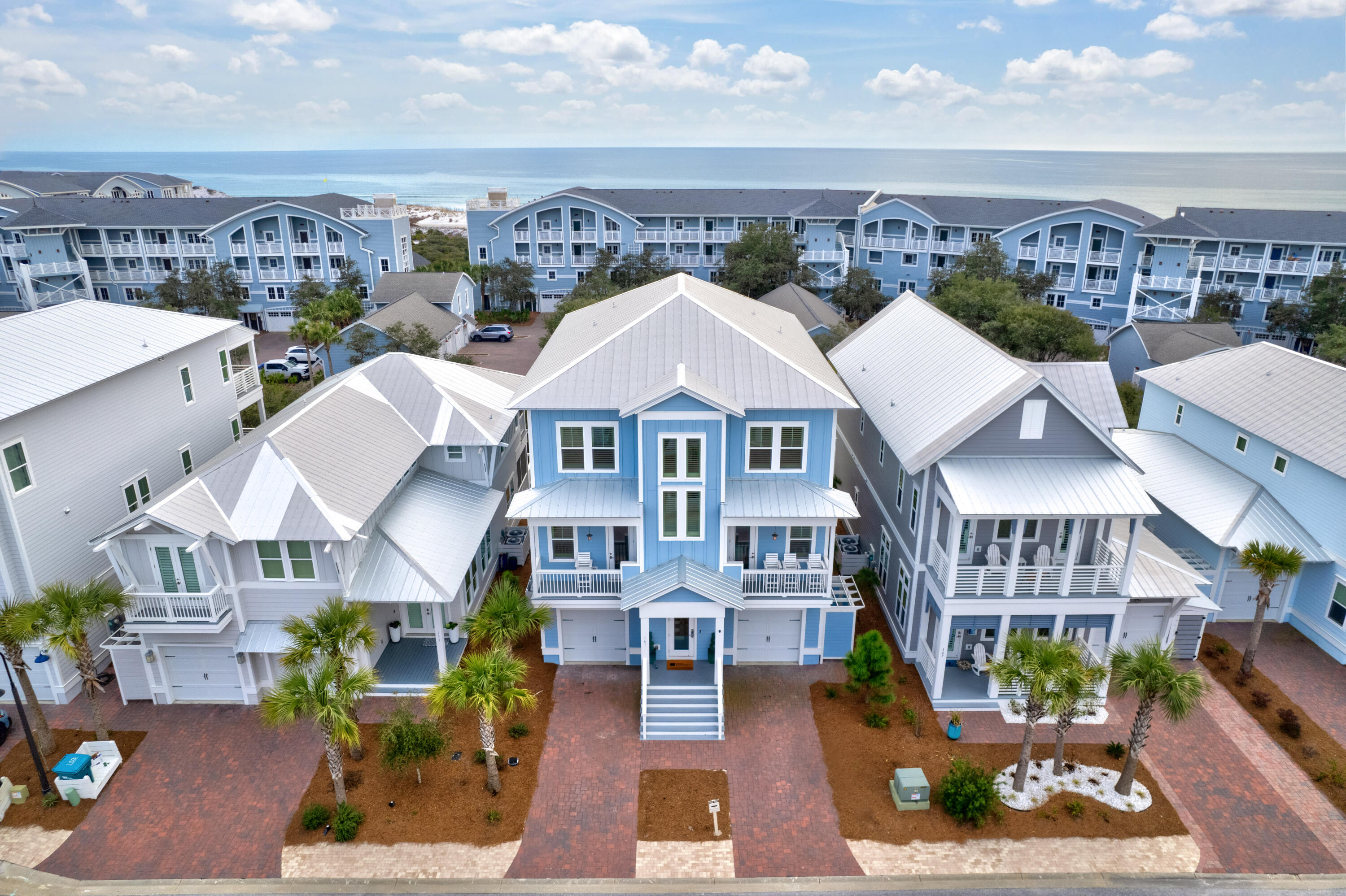 LUXURIOUS FULLY FURNISHED INVESTMENT PROPERTY WITH $200,000 INCOME POTENTIAL! A premier investment opportunity awaits in Prominence South, just off 30A! This fully furnished, turnkey 5-bedroom coastal home boasts projected short-term rental income EXCEEDING $200K annually. With three stories of luxurious living, each bedroom offers an en-suite bathroom, ensuring privacy and comfort for up to 12 guests—perfect for investors seeking high returns or those desiring a spacious, fully equipped beach getaway. The primary suite on the third floor includes two walk-in closets, a large master bath with double vanities, a wall-to-wall walk-in shower, and a private balcony showcasing stunning Gulf views. The gourmet kitchen features custom soft-close cabinetry, quartz countertops, a 5-burner gas stov