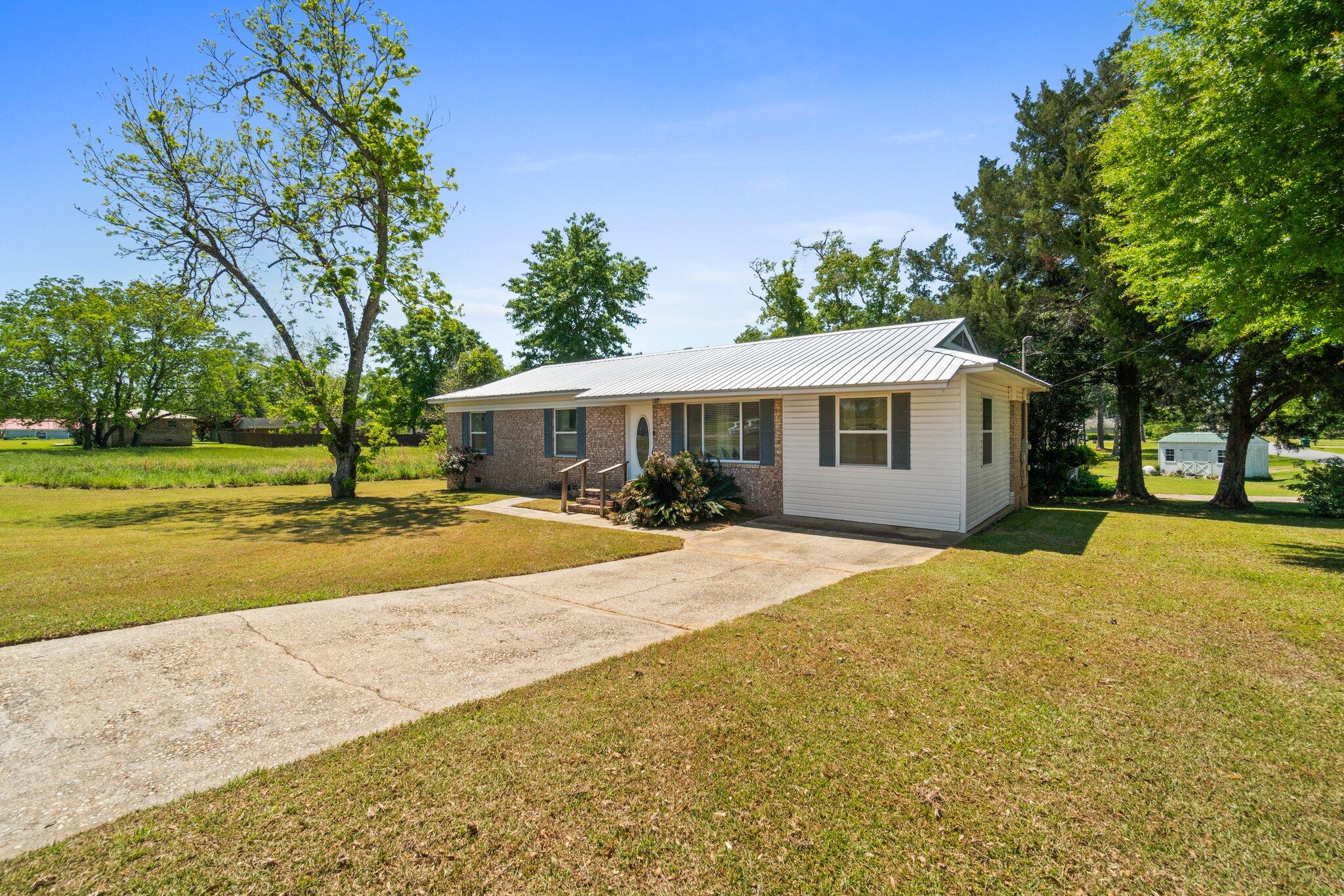 Welcome to 5417 College Drive in Graceville—a charming and well-kept 4-bedroom, 2.5-bath home situated on a spacious corner lot directly across from The Baptist College of Florida. With 1,463 square feet of comfortable living space, this home features a brand-new roof, updated water heater, and newer HVAC system for added peace of mind and efficiency.

Whether you're a family, college staff member, or student, the functional layout and prime location offer easy access to Chipley, Dothan, and all that Graceville has to offer. Enjoy the perfect blend of character, modern updates, and convenience—all in a quiet, sought-after neighborhood.

Don't miss your chance to call this home—schedule a tour today!