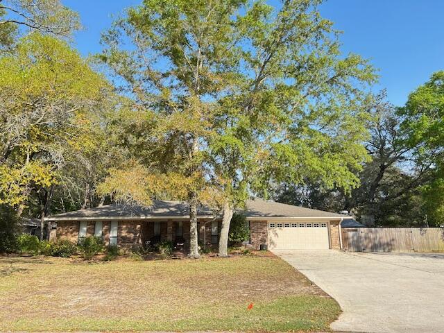 PRICE IMPROVEMENT! Come see this beautiful single story all brick 4 bedroom/ 3 full bath & private office home offering an upgraded open floorplan with 2 living areas. 221 Olde Post Rd is located on a corner lot for more privacy and a spacious 2-entrance circular driveway for easy ingress and egress. There are also 3 concrete pads on the side of the house: 12' x 53' and extra 14'x 18' pad, along with shed on a 10 x13 pad which are all located inside the fenced side and back yard. Ready for boat, RV storage, etc. You will enjoy many upgrades including crown molding throughout, double French Doors leading to the additional 18 X 32 spacious living area, floor to ceiling windows, trey ceiling, gas fireplace, built in bookshelves with cabinets along with double glass doors leading to the covered lanai and large fenced backyard. The pantry & laundry room located off the kitchen continues to the back hallway and extra storage closet. Master bath offers double vanity sinks, garden tub, separate shower and linen closet. The 2nd guest bath also offers double vanity sinks. This home has been plumbed for natural gas in the kitchen along with gas water heater, fireplace and clothes dryer. The double garage includes sturdy custom built wood shelves and workbench. During the addition and renovation, all duct work was replaced and new insulation was installed. Also, extra outlets were installed in the garage for appliances as well as a 220v outlet. An existing 220v outlet is located in the backyard next to the shed. Raintree Estate owners enjoy larger private lots and a low non-mandatory HOA of $150 annually to enjoy two beautiful neighborhood parks for social gatherings. Relax at the Beach/Bay Park with it's beautiful sunset vistas, covered pavilion, BBQ firepits, along with 2 docks. One on the bay and one on the bayou for fishing and kayak launch (Entrance - End of Southminster Ct.) . The centrally located woods park offers a ballpark and trails to explore (Entrance - End of Pembrooke Ct.). Raintree Estates residents benefit with convenient location to Mid-Bay Bridge, military bases, Fred Gannon Rocky Bayou State Park & Boat Launch, local groceries, restaurants, shops and entertainment.