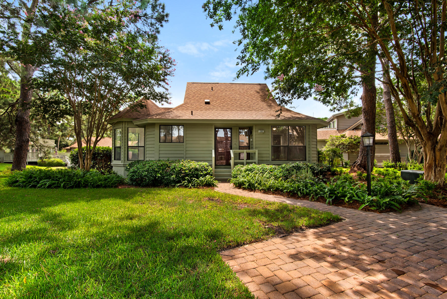 Welcome to The Fairways of Sandestin. This Lake Front Florida Cottage is nestled amongst the tall pines of this serene neighborhood within Sandestin Resort. Just a short walk to the Bay, Pool, Golf, and Dining, and a Golf Cart drive to Baytowne Wharf, the White Sandy Beach on the Gulf of Mexico, and more. This efficient 2 bedroom, 2 bath floor plan allows plenty of light and views throughout. Views of the Lake from your first steps into the Foyer, to the Living Room, Dining Room, and Master Suite. The spacious Screened Porch, Deck, and Yard add fantastic outdoor Lake Front Living. New Roof in June of 2022; New Paint inside and out, appliances, and HVAC Duct Cleaning in 2024 and 2023. Sandestin Resort has unmatched Amenities for you to enjoy. Don't miss this beautiful, Lake Front Cottage!