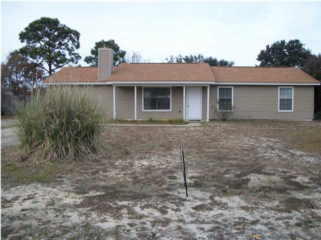 Darling home only 15 minutes from Hurlburt AFB, minutes from beaches, large fenced yard. Hardwood floors in living, dining, hallway, carpet in bedrooms and family room. Tiled kitchen and baths. Must see to appreciate! Great family neighborhood. Owner will consider one pet with approval and a non-refundable pet fee.