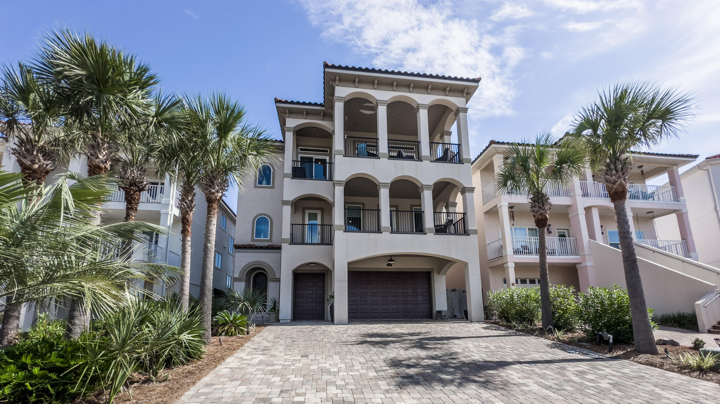 PRICE REDUCTION $100K! This beautifully designed home located in the exclusive gated community of La Valencia Beach Resort offers luxury coastal living with beautiful beaches and resort-style amenities. The foyer leads to a welcoming den area with a convenient kitchenette which is perfect for entertaining guests. A cozy bunk room adds extra sleeping space. The next level includes two spacious bedrooms, a primary suite, another living area and a second kitchenette. The third floor is the showstopper, boasting an expansive living room, a spacious primary suite, dining area, and a chef's kitchen complete with lime oak flooring, 6-burner gas range, and a large center island. Off the main area is a large covered balcony with gorgeous gulf views. Perfect for coffee or cocktails.  Highlights: 2 primary suites, 3 living areas, elevator, 3 car garage and golf cart garage, don't miss this great home!
Enjoy the video and 360 photos to view this gorgeous home, the gulf front pool with deeded beach access, owners' only pool, tennis courts, and pickleball courts.  The driveway will accommodate 6 cars in addition to the 3 car garage space!