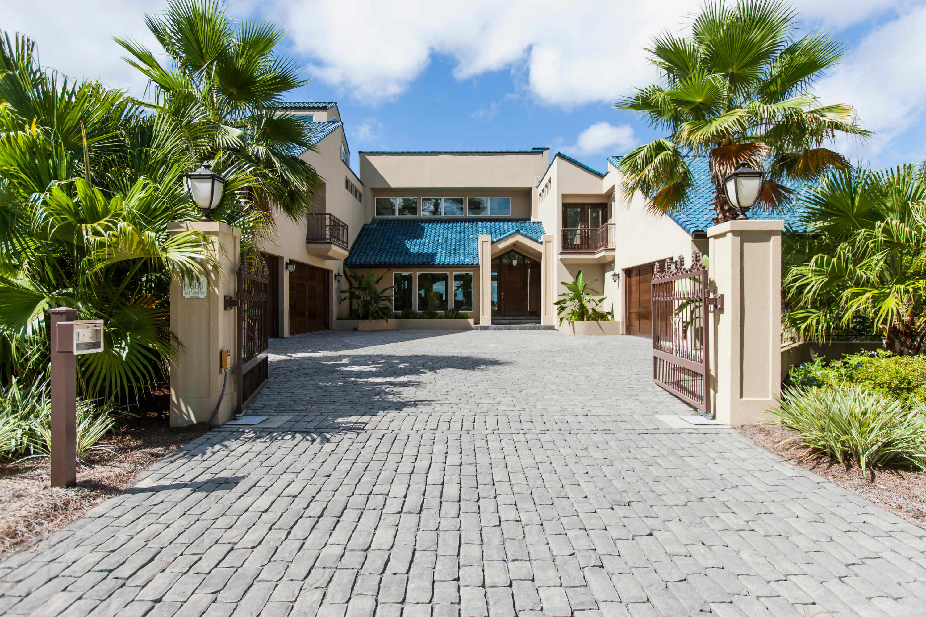 Incredible custom home situated on a large bay front lot in the desirable gated Bay Point Golf and Yacht Club community. This must see home was completely renovated in 2015 at a cost of over $2,000,000 and features exceptional construction, quality materials, with a private gated entrance all on 90 feet of bay frontage and just minutes away from the pass. The formal dining area is adjacent to the living area and the updated gourmet Chef's Exhibition kitchen that will please even the most demanding of cooks that features Sub Zero and Wolf commercial grade appliances throughout, a large center island for entertaining, gleaming marble counter tops and fabulous butler's pantry next to the kitchen has lots of storage and counter space for easy entertaining. Also on this level is the incredible master suite, with a generously over-sized bedroom and sitting area with fireplace, both with bay views, and a luxurious master bath with marble double vanity, jetted tub, separate walk-in steam shower, large walk-in closet with custom built-ins. Step out onto the lanai and enjoy a tropical oasis, resplendent with a sparkling heated pool, hot tub, features include a full summer kitchen, numerous seating and lounging areas surrounded by lush, mature landscaping, gas fire pits and strategically designed outdoor lighting. Private dock conveniently located on a deep water canal with shore power that can accommodate boats up to 70 feet, plus jet ski lifts and bait well at dock for the serious fisherman... This must see, water front oasis is the perfect place to savor the legendary Grand Lagoon sunsets. No expense has been spared on this palatial home! 

Every modern convenience has been provided in this expansive, well-designed floor plan in a jewel of setting. Renovations include: All new exterior and windows, all new interior finishes, new bathrooms including over-sized steam shower in master, new commercial grade gourmet kitchen, new hot water heaters throughout, new HVAC units throughout, upgraded main electrical panel and fully automatic 70 kw commercial backup generator, State of the Art audio visual system, IC Real-time electronic lighting and heating system, State of the Art 16 camera security system with remote access, electronically controlled front security gate, air conditioned garage work area with air compressor, new pool and hot tub, upgraded 90' dock with built in aerated salt water bait-well and twin jet ski dock, and a commercial 30lb. ice-maker.