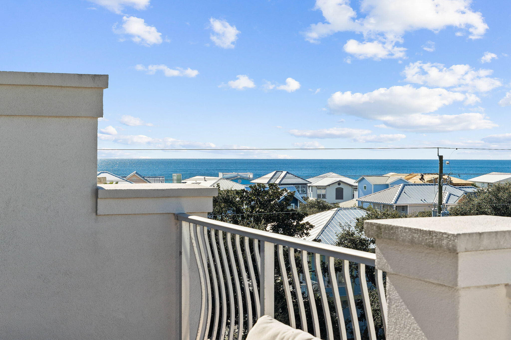 Welcome to 16 Summer Place (Unit 12) on 30A, a fully furnished 4 bedroom, 4 bath townhome with gulf views. Summer Place is a laid back, beach lover's community with a heated pool and only 14 townhomes. It is ideally located for enjoying the lifestyle of 30A. After a day at the beach at Ed Walline Park, just steps away, take a quick stroll to the shopping, dining and entertainment of Gulf Place or bike to other coastal towns. The three levels include hard wood and natural stone flooring, crown molding, 10' ceilings (2nd and 3rd), and a one-car garage. The large guest bedroom and ensuite bath on the first level offer access to the back patio, perfect for grilling. The main living area on the second level is adorned with natural sunlight, gracious seating, a fully equipped kitchen with... stainless steel appliances and granite countertops. The third level hosts the master suite and spacious secondary bunk room, each with a full bathroom. Enjoy southeastern and southwestern views of the Gulf of Mexico from the private and expansive roof top terrace.  We invite you to make an appointment today to discover Summer Place living.