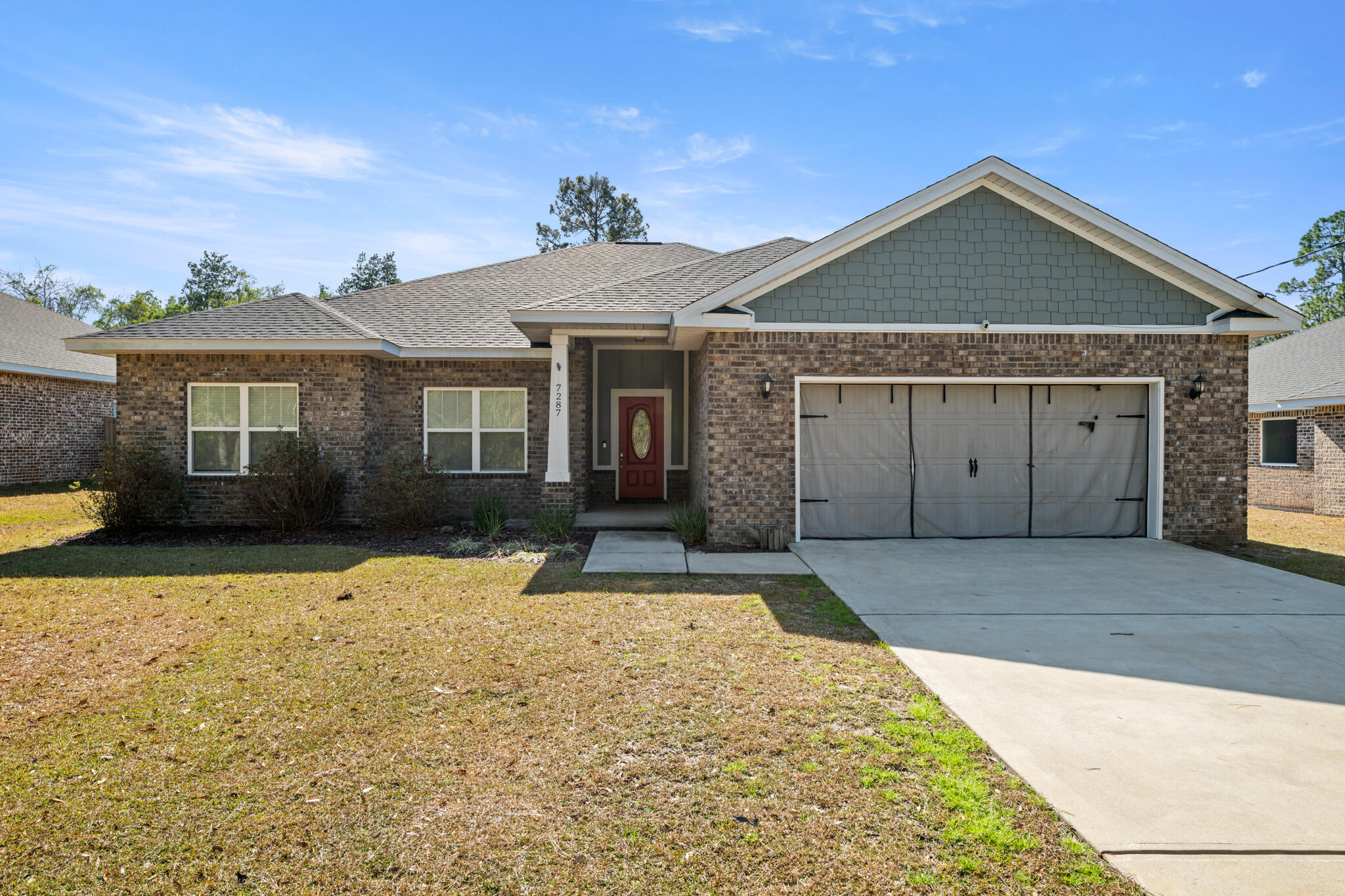 Price Reduced by 10K!! NO HOA! OPEN FLOOR Plan in this ALL-BRICK home that features 4 bedrooms and 2 bathrooms on a large  .37 acre fenced lot. OPEN FLOOR PLAN that is great for entertaining. LVP flooring, double tray ceiling and crown molding.  Kitchen has SOFT CLOSE cabinets with granite countertops, a large island with breakfast bar, pantry, and stainless steel appliances. The master suite is complimented with a lighted tray ceiling, crown molding, leading into a spacious ensuite bath complete with granite double vanity, water closet, soaking tub, and TILE SHOWER with GLASS door. Three (3) spacious additional bedrooms with separate bath.  SPACIOUS COVERED PATIO compliments the large back yard.  GARAGE has a 30 AMP for RV or Electric Car. **MUST SEE and only 8 miles to Navarre BEACH! Great Incentive $7000 towards Buyer Closing Costs and/or Rate Buy Down! ASSUMABLE LOAN with 3.5% interest rate is available.