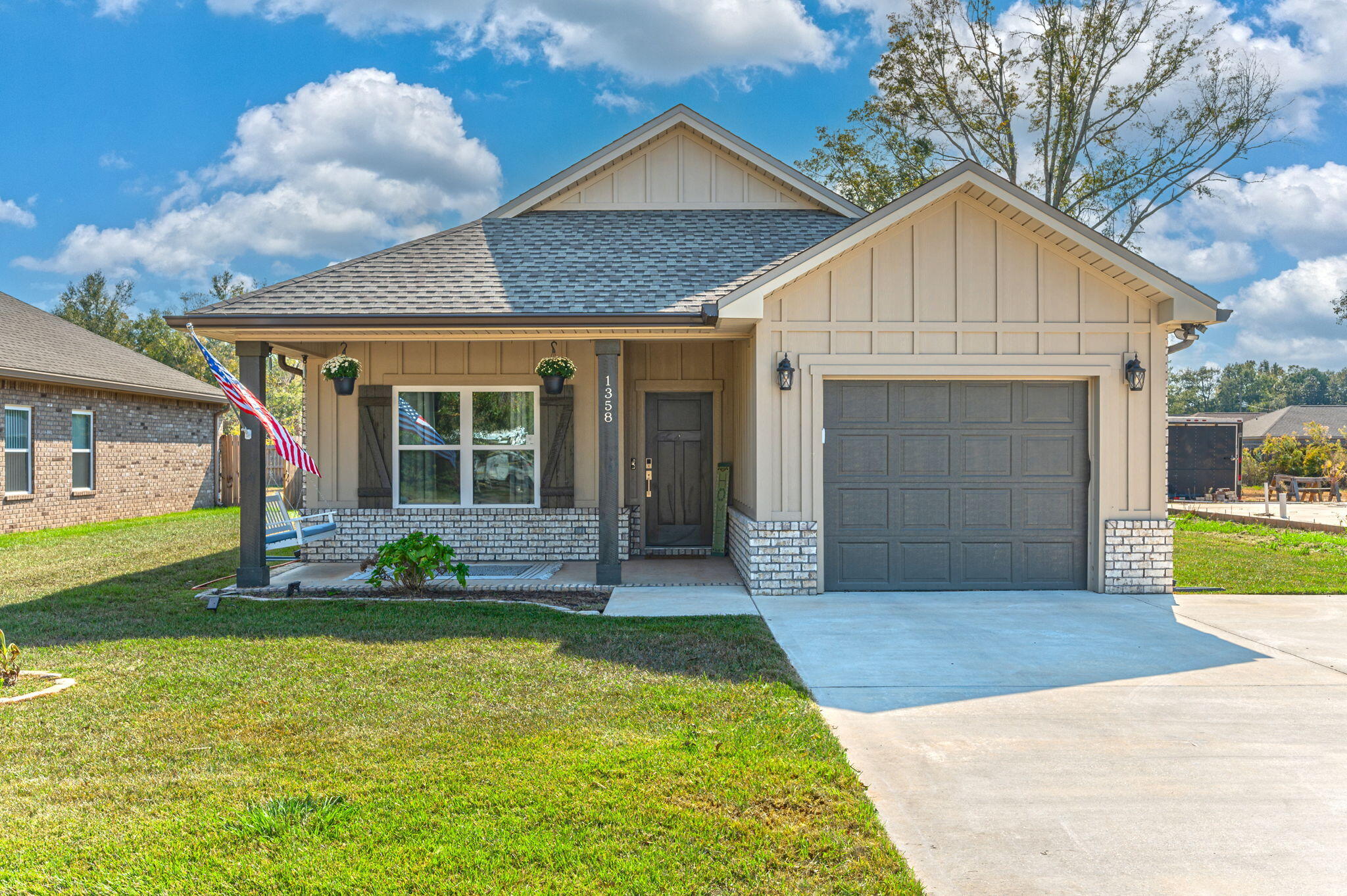 Welcome to your home in the heart of Baker! This beautifully maintained 3-bedroom, 2-bathroom house offers a cozy atmosphere with modern amenities. The kitchen features white shaker cabinets with soft-close doors, a large island with additional storage, and granite countertops that encase a stylish farm sink. The rest of the home boasts luxury vinyl plank flooring in all living areas. Finalized with a finished garage, gutters, and a privacy fence. Extra concrete has been poured for additional parking! The property is in a quiet neighborhood, providing a peaceful retreat while conveniently close to local shops, schools, and parks. All major appliances are included with the home.