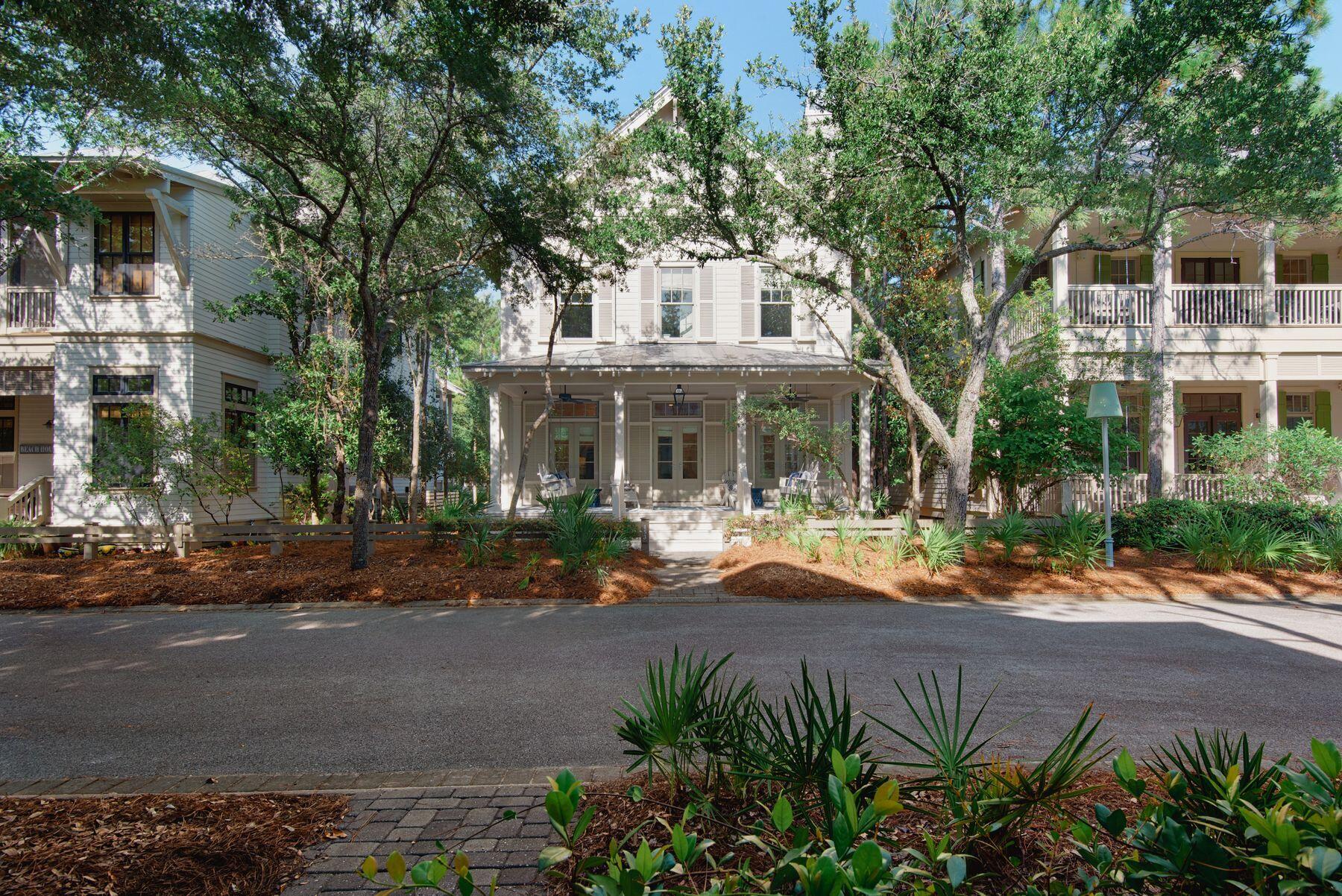 Timeless coastal sophistication and graceful southern charm define this extraordinary six-bedroom retreat, perfectly positioned just steps from Camp WaterColor and minutes from the gulf. Recognized by Southern Living as a coastal showhome, this exquisite residence stands out not only for its architectural quality but for its thoughtful design and spacious layout, making it a rare opportunity for a family compound, second home, or elegant primary residence.The main level is designed for entertaining, anchored by a chef's kitchen with granite countertops, an Italian farmhouse sink, custom cabinetry, and a six-burner gas range. A cozy dining nook with built-in banquette flows seamlessly into the airy living room, where shiplap walls, a gas fireplace, and abundant natural light set a warm inviting tone. French doors open onto an expansive covered front porch with an oversized swing, the perfect place to savor lazy afternoons. A serene king suite on this level features a spa-like bath with a soaking tub, a walk-in shower, and a private water closet.

The second level offers four spacious guest suites, 3 with private ensuite baths. Additional conveniences include a zoned HVAC system and three Guardian Air ultraviolet air purifying systems that clean the air hourly, ensuring year-round comfort and peace of mind.

The detached two-car garage is crowned by a beautifully appointed carriage house, offering a private one-bedroom suite complete with its own living and dining area, full bath, laundry, and separate entrance  perfect for guests. Recent updates include refreshed paint, lighting, countertops, tile, and bathroom upgrades, as well as extensive exterior maintenance completed in July 2025.

Owners enjoy an unmatched lifestyle with access to the WaterColor Beach Club, Camp WaterColor with its lazy river and slide, tennis center, parks, trails, fitness facilities, and proximity to the boutiques and restaurants of Seaside, Florida, and 30A. Refined, meticulously maintained, and thoughtfully updated, this is a rare opportunity to own one of WaterColor's most spacious and distinguished homes.