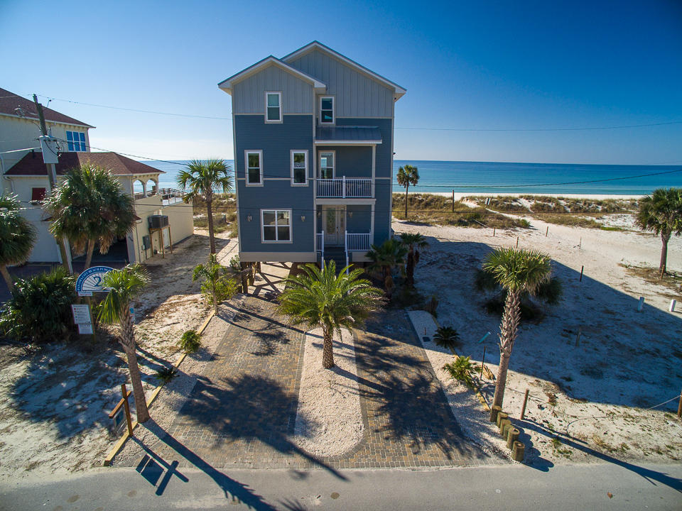 23 feet above sea level, sitting atop crystal white sands, rests a sanctuary, with dramatic East/West gulf views and stylish interior appointments combining to envision one of the most outstanding homes on the Emerald Coast. A one of a kind gulf front showplace located on secluded Beach Blvd offering the best unobstructed views the gulf has to offer from its 3 stories of balconies and wall to wall hurricane impact windows. The entire third floor is dedicated to the incomparable ''Masters Quarters'' featuring an open floor plan, Cathedral ceilings, theater room, kitchen, and a private balcony with a hot tub. The 4 stop luxury elevator allows you to navigate seamlessly throughout the multi leveled home starting from the street level car port underneath the home. At 5175 square feet, 7 bedrooms and 6.5 bathrooms, "Sea Forever" sleeps up to 23 guests and is an absolute rental haven for family, friends and vacationers alike. In 2015 alone this home brought in over $210,000 in rental income with a late start into the rental season, and with $30K not booked due to owner usage. Projections for 2016 with Spring and Summer already fully booked are to surpass $250,000 in rental income. Builder Joe Rudolph completed this home in March of 2015 under the direction of architect J.Michael Hunnicutt.

"Sea Forever" conveys fully furnished and rental ready with a list of additions and improvements that the owners will have completed by Spring of 2016 which will boost the rental income for this home. The owners take great pride in their home and the future improvements are a testament to their commitment. This list includes new tiling of the front porch with stone veneer accents along the sides. The magnificent first level pool deck will be expanded about 3 feet all around and will wrap around to the downstairs bathroom as well as the pool equipment deck. Underneath, and along the circumference of the house will be concealed and finished off for an aesthetically pleasing look. Extensive closets and owner's storage on each level (five very large owner's closets.
(If any of these are not completed prior to the sale, allowances can be included as part of the sale agreement.)

"Sea Forever" has an abundance of custom features which are available in the documents portion of this MLS listing clearly itemized in a Word Document for viewing or printing. The pictures tell it all for this home, and they do not do the property justice, it is a must see. We have included all of those features in the attached documents portion of this listing.