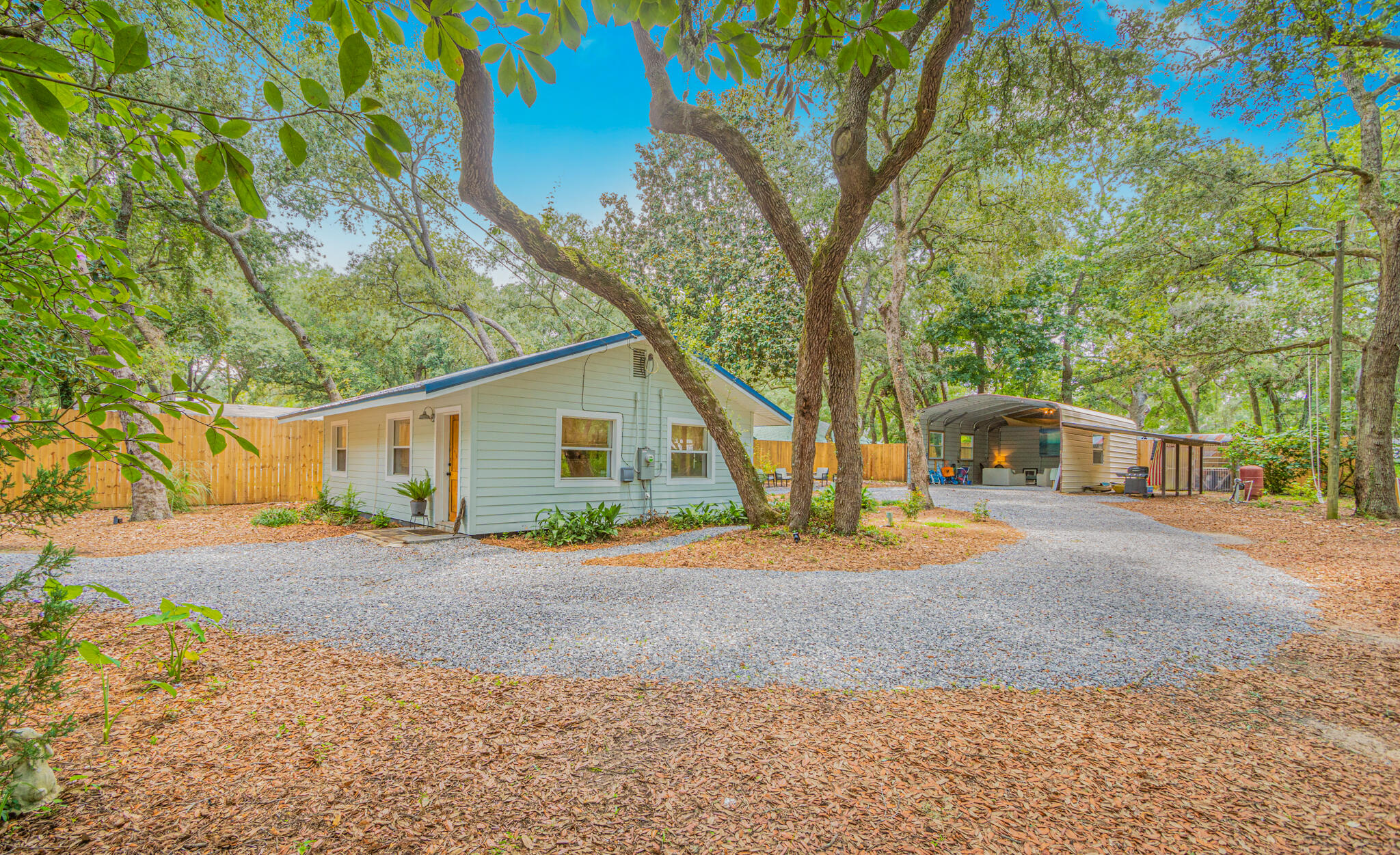 INCOME PRODUCING! RECENTLY APPRAISED! EXCELLENT BUY ONLY 15 MINUTES FROM THE BEACH! Have your boat in Choctawhatchee Bay literally in five minutes since you are across the street from the public boat launch, while NOT in a flood zone! Turn key fully furnished beach cottage on over a quarter acre with huge trees and lush landscaping.  So many options as full time AIrbnb or for living year round, or half and half. Substantial renovations summer 2024: metal roof, hardie plank siding, new hot tub, cobblestone pavers, etc. Outdoor steel quonset hut, firepit area and ample parking for boats, RVs and ALL your toys. . This property is a 'quest favorite' offered by a seasoned Airbnn Super Host.  Buyer to verify all info important to them!  Priced to Sell!