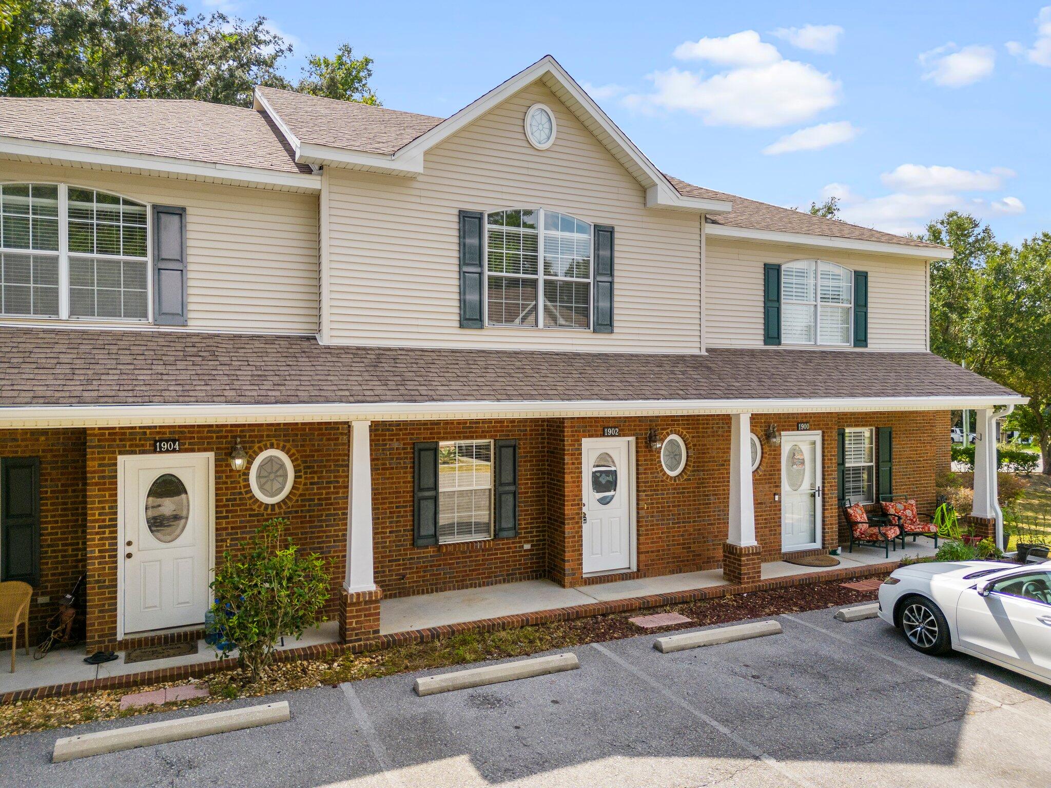 Enjoy Niceville living without the upkeep of a large lot with this classic Florida townhouse. Greeting you as you return home is a handsome brick entry and brick trim porch perfect for relaxing in the warm Florida sun or enjoying the cool winter breeze. This 2bd/1.5ba unit offers fully tiled main level flooring, and features characteristics such as stainless appliances, and a spacious kitchen. The upper level provides much comfort with a large primary suite that includes an ensuite bath, an oversized second bedroom, and an abundance of natural light. Ease of access to major military installations, Northwest Fl. State College, shopping, and recreation round out this prime unit.