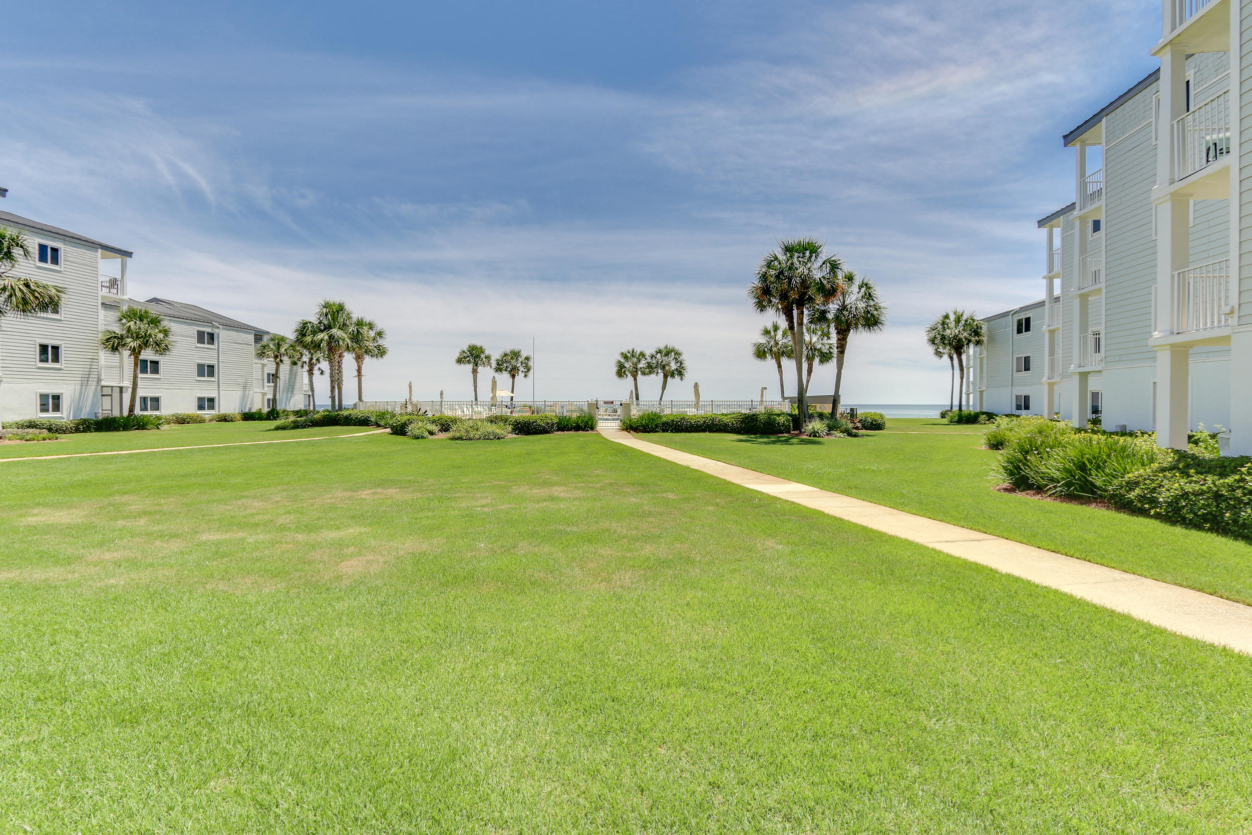 Few places can capture the magic of the Emerald Coast and the beaches of 30-A...this lovely one bedroom condo at Sand Cliffs does. Sited in a prime location in the building to allow you to walk straight off your porch to the beach and Gulf views, this condo exudes sophistication and embodies an eminently livable floorplan and effortless style. Conveys furnished with all you need to enjoy the beach life. Sand Cliffs is a perennial favorite of owners- enjoy the sparkling beachside pool, bbq grill area and the lush, well maintained grounds. Spend your days shopping and eating in the quaint beach towns including nearby such as Seacrest Beach, Rosemary Beach, Alys Beach and more.Each owner also gets 1/71th of the vacant parcel across the street which is owned by Sand Cliffs, what a bonus!