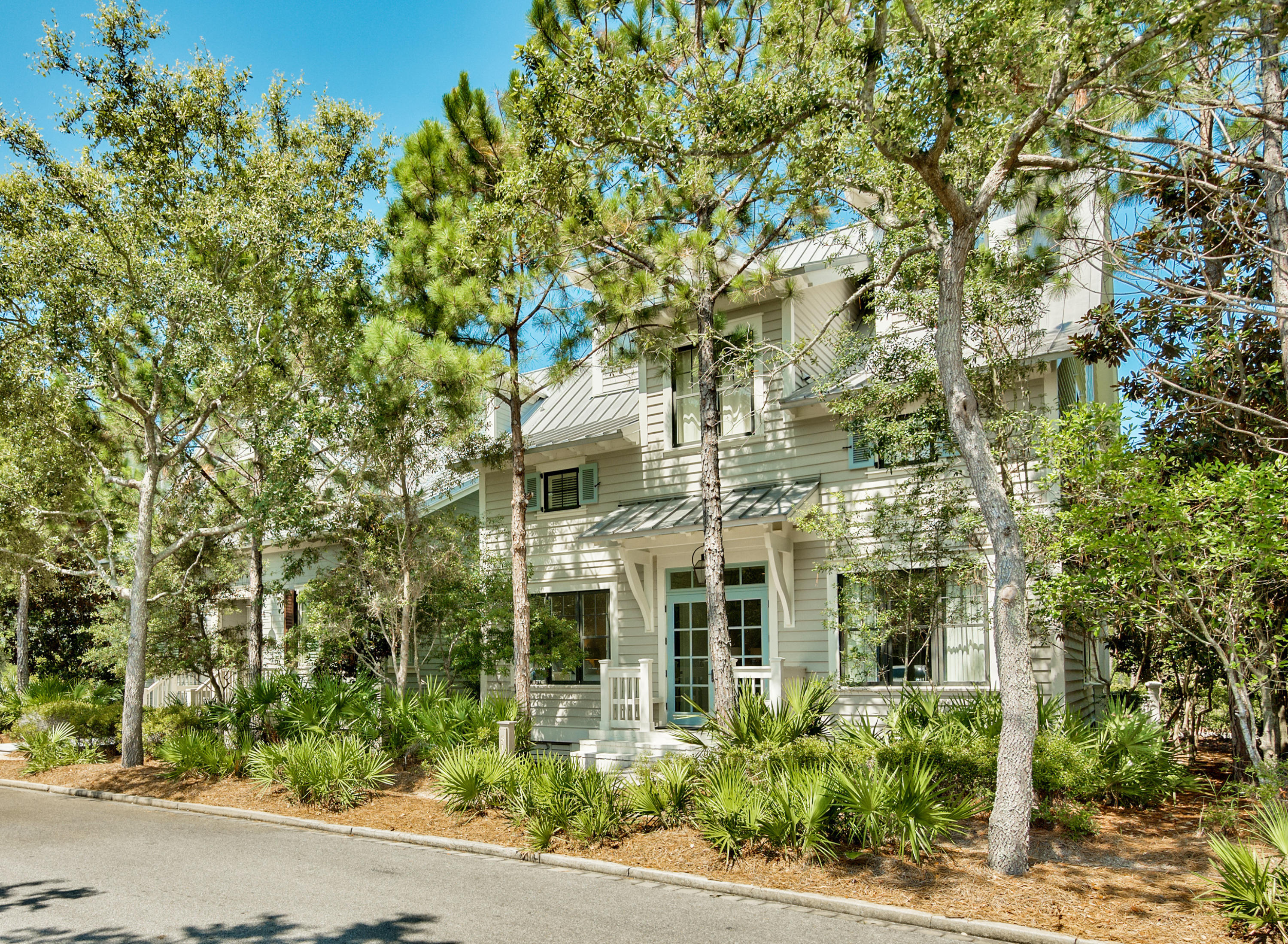 Priced to SELL! Well-priced, luxurious WaterColor residence, prominently situated south of 30A ​in the premier location of the exclusive Park Row ​neighborhood offers three stories of extraordinary living space. Offered fully furnished with interiors by Suzanne Kasler. Overlooking the Gulf of Mexico, Grayton Beach State Park and Western Lake, this ​exclusive and private south of 30A ​location is rarely available. Designed with exquisite detail, this five bedroom, five full private bathroom home offers forever views and stunning sunsets. The first floor offers two spacious guest suites with private, spa-like baths outfitted with premium WaterWorks plumbing fixtures, classic marble countertops and sleek glass tile. Crisply painted wood walls and a single piece, wroug baluster lead guides the way from the first level upstairs to the second floor. Spacious and open living and dining areas fan out to the west through a wall of French doors to an ample covered porch. The sides of the porch that neighbor the adjacent homes are shuttered for privacy. 
The chef's dream kitchen centers on an oversized island with single-piece, marble countertop measuring 6x10 feet that capably seats 7.  With room left for the Thermador gas cook-top, it is accompanied by stacked, Thermador ovens and other Viking appliances, including a dedicated ice-maker as well as a walk in pantry. The open kitchen maximizes your entertainment options. An additional guest suite with private bath as well as a powder room with concrete vessel sink complete the second floor.  The stairs to the third floor lead past a cozy reading nook and bunk room with two bunks and private built in flat screen televisions.  Built-in drawers make efficient use of this cleverly utilized space. Just behind a sliding barn door is an adjacent full bath.

The vaulted, wood-paneled ceiling master suite is an opulent sanctuary that offers ample comfort and relaxation.  Light is invited inside through a row of French doors that lead to a private, covered porch with gorgeous views of the Gulf. The sunny master bath features a double vanity with quartz countertop, a separate shower with rain head and slipper tub, and basketweave mosaic tile floor with blue accent tiles. This residence is steps from the a wealth of amenities that include multiple pools, a tennis center, boat house on Western Lake and Gulf-front beach club.  51 Park Row Laneâ€‹ offers an incredible vacation rental option withâ€‹ established income historyâ€‹ â€‹and â€‹a strong rental projection of over $210,000!  Watch Watercolor VIDEO TOUR!