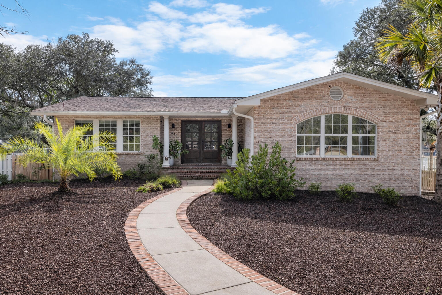 See professional video! This unique deep waterfront property offers the perfect blend of coastal living, space and comfort. Situated on a generous .66-acre lot, this all-brick home with full guest house provides stunning views, quick access to the Gulf and a convenient location just minutes from shopping, restaurants, VPS Airport, Fort Walton Hospital, Hurlburt Field and Eglin AFB.  Most recent improvements include new boat lift, ski lifts, interior paint, tankless water heater, new landscaping, new stairs on back deck and carriage house and updated lighting. The home underwent a complete transformation in 2006, being taken down to the studs and fully renovated with new plumbing, new electrical and new finishes throughout. On the upper level, you'll find 3 bedrooms and 2.5 baths, while the lower level includes an additional bedroom, full bath, spacious living room and wood burning fireplace. Above the garage you'll find a 1 bed/1 bath carriage house with living room and full kitchen. With its deep-water access, expansive grounds and beautifully maintained interior, this property captures the essence of waterfront living at its finest.