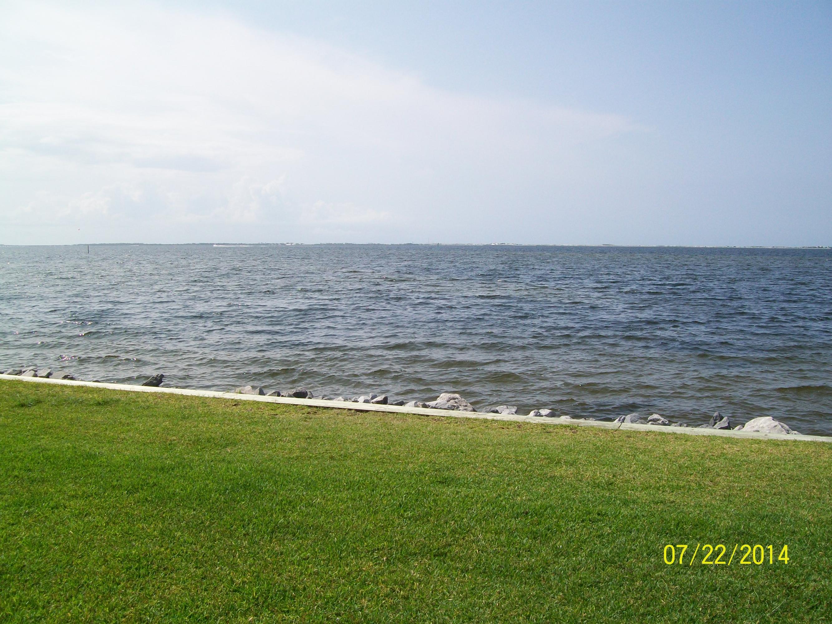 You have to see this view for yourself! WATERFRONT! This 1 bedroom, 1 bath unit is completely furnished. All you need to bring is your clothes and linens. Located on the Choctawhatchee Bay, you can swim, fish, or float right outside of your patio door. You also have views of the fireworks put on by the area cities right in your backyard! The unit is all tile through out and located on the 1st floor. Water, sewer, trash are included. The complex has a community pool and laundry room for guests.