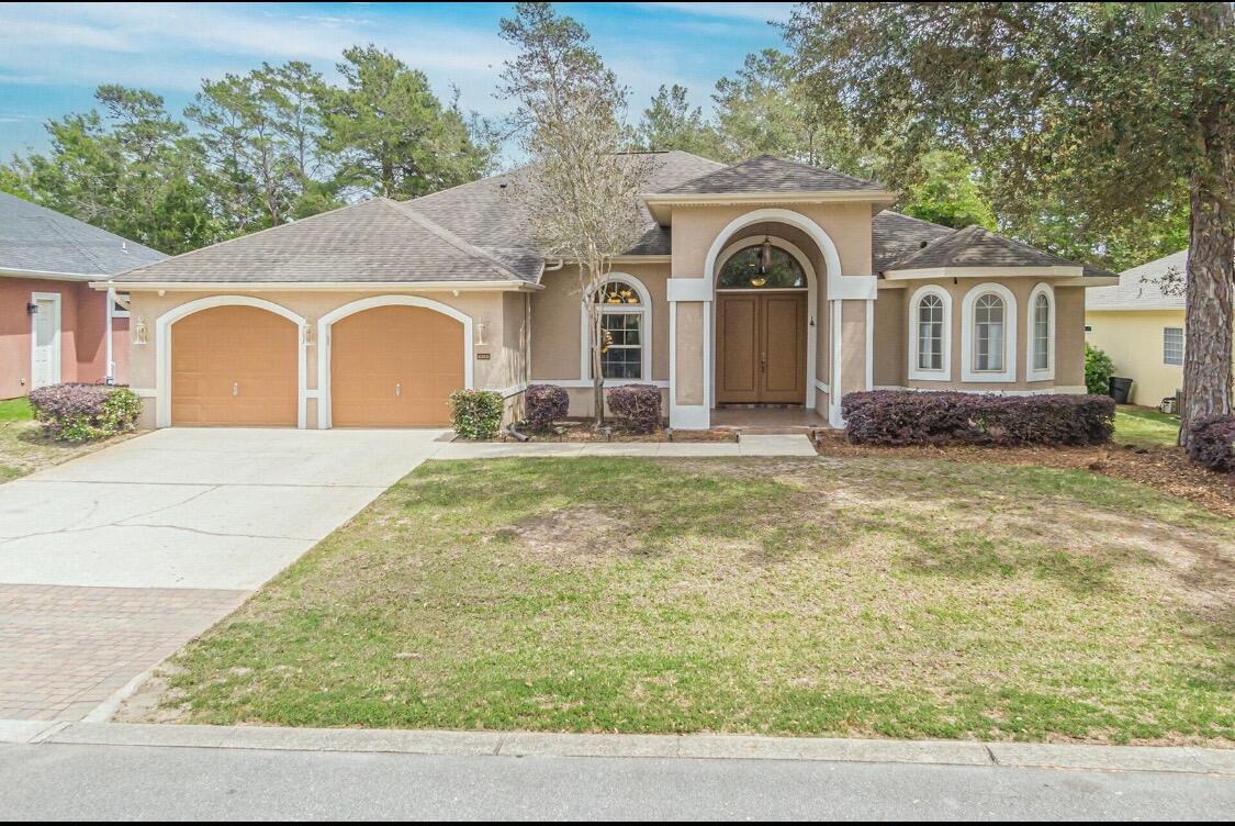 Located in the sought after area of Chardonnay Estates in Bluewater Bay, and only 10 minutes from the Destin beaches. This immaculate move in ready home features tall tiered ceilings, huge windows, an awesome open floorplan that feels much larger than the square footage. The master suite makes up an entire wing of the home and features a sitting area, two separate walk in closets and a huge spa like bath tub. Perfect for entertaining, this property has 2 oversized living areas and a wet bar just off the spacious kitchen with center island! There are 3 full baths, and 2 additional generously sized bedrooms. The big glass patio doors open up to a covered back porch. There is an outdoor shower and a door leading to the back porch just outside the 3rd bathroom. No smoking. Pets  allowed pending owner approval and nonrefundable pet deposit.