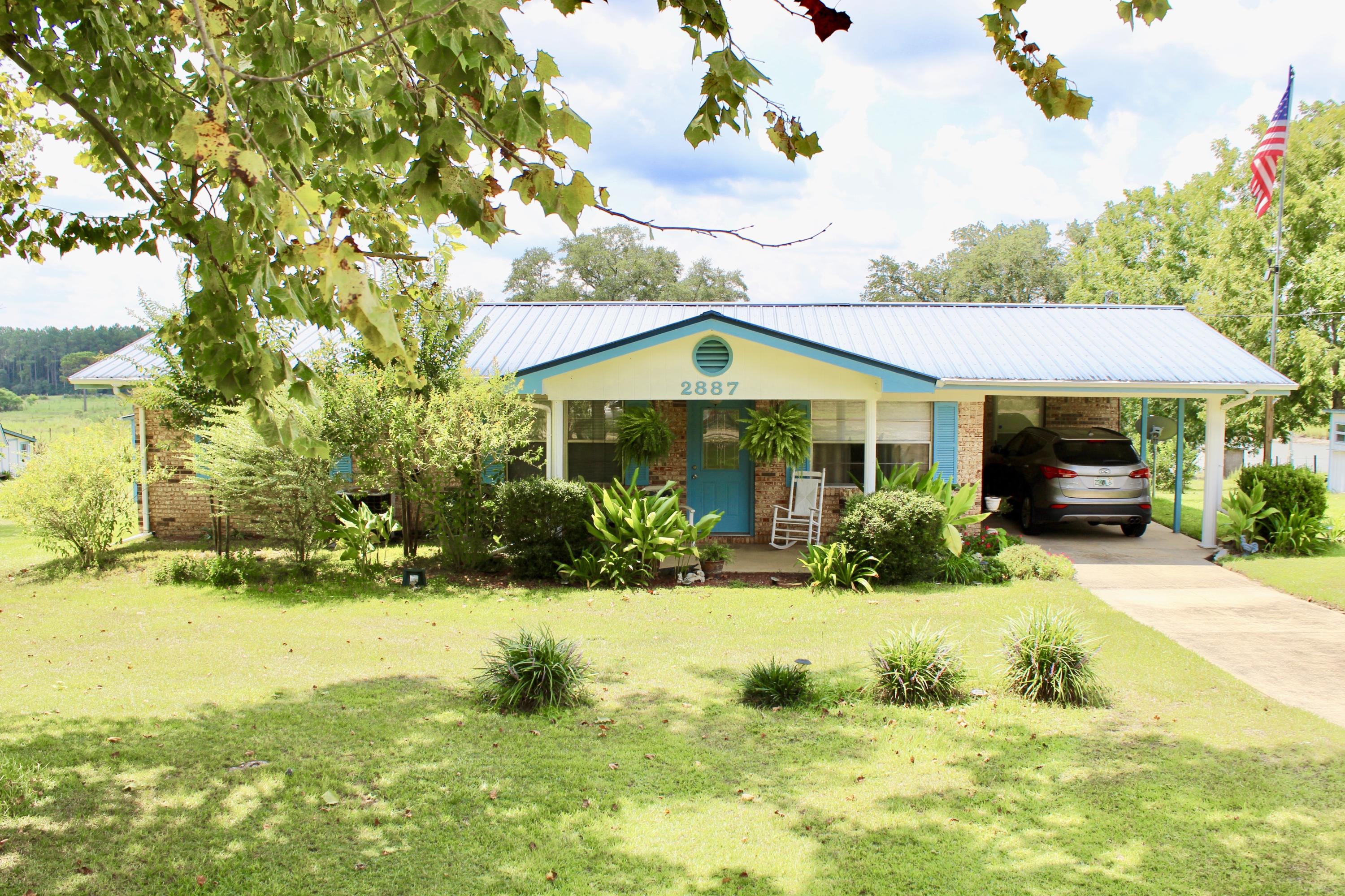 Country Living but not far from town. Only 34 miles to mid bay Bridge. This home is surrounded by pastures. Sit in your A/C sunroom or out on the patio and relax with the beautiful view of the grassy hills and a large pond. The outside patio has a small built in refridgerator to keep your drinks cold. There is plenty of outside storage. Storage buildings have electricity and water. There are numerous fruit bearing plants and trees (pecan, grapes, plus). As you enter the home you will find two nice size rooms one on each side (den, office or space to add a 3rd bedroom). You also have a very large family room which currently has a nice stove/heater (owner willing to sell it to the next owner).
This home has been very well kelp and is just waiting on the next owner to call it home.