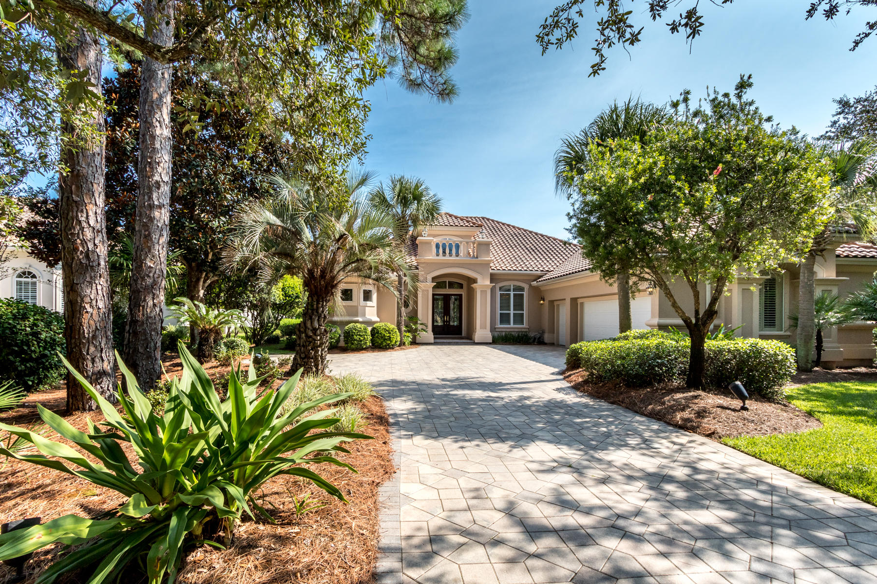 Lakefront, single story living, with private pool in the prestigious golf course community of Regatta Bay. Enjoy ultimate privacy overlooking a sizeable expanse of waterfront on convenient Captain's Circle. Decorative concrete pavers line a wide driveway, through mature vegetation to a multi-faceted stucco home. A roomy two and one-half car garage allows the owner to enjoy golf-cart parking plus additional storage. The convenient split floor plan promotes privacy while encouraging gathering in the open kitchen/living area. Indoors blends seamlessly with outdoors through fully retractable glass sliders which lead to the expansive screened lanai with pool/spa and outdoor kitchen. Lake views are highlighted from multiple vantage points and lead to the expansive screened lanai with pool/spa and outdoor kitchen. An open-concept kitchen features timeless custom wooden cabinetry while granite counters deliver durability. A secluded master suite overlooks the pristine lake and enjoys private access to the lanai. Neighborhood amenities include an award-winning golf course, club house, tennis court, pool and playground. Walk or ride your golf cart to stores, movie theater, and restaurants in Destin Commons or the Legendary Marina and LuLu's next door. Call for your private showing.