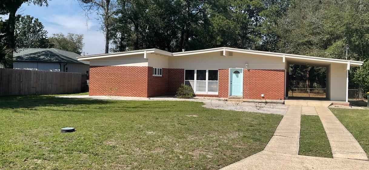 LOCATION! New exterior paint 2024! Exceptional home in the heart of Fort Walton Beach! Close proximity to all of Downtown's shopping, dining, and entertainment and minutes to both bases!  This home boasts an open floor plan, a beautiful large brick fireplace, Terrazzo flooring, tons of natural lighting, and an indoor laundry room! NEW HVAC 2022!  From your living room, you have a view of the large backyard. Use your imagination and bring the canvas to life! Outside you'll also find three storage areas and a fully-fenced back yard. Make 49 Waynel Circle SE your Fort Walton Beach home today!