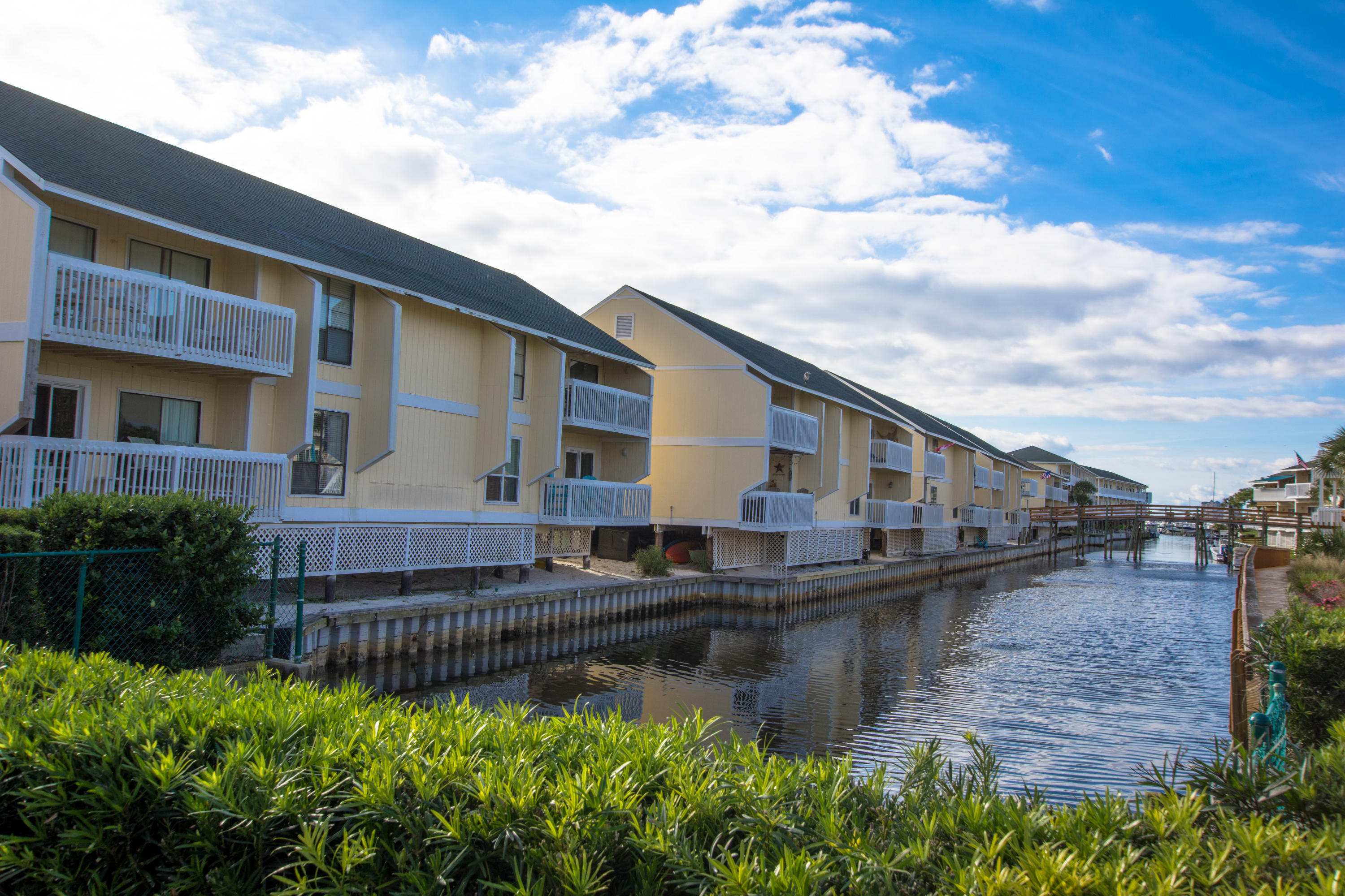 This lovely CANAL FRONT condo has everything you need to start enjoying the fabulous beach lifestyle. Great view of the canal from your private balcony and just a short stroll to the beach. Many great amenities including marina, 5 pools, 3 hot tubs, 6 tennis courts, a Par 3 executive 9 hole golf course and 2 onsite restaurants. This popular resort is located near many great attractions. Plenty of room for the whole family, you can also do vacation rentals to capture high dollar summer rental income. Buyer to verify all information.