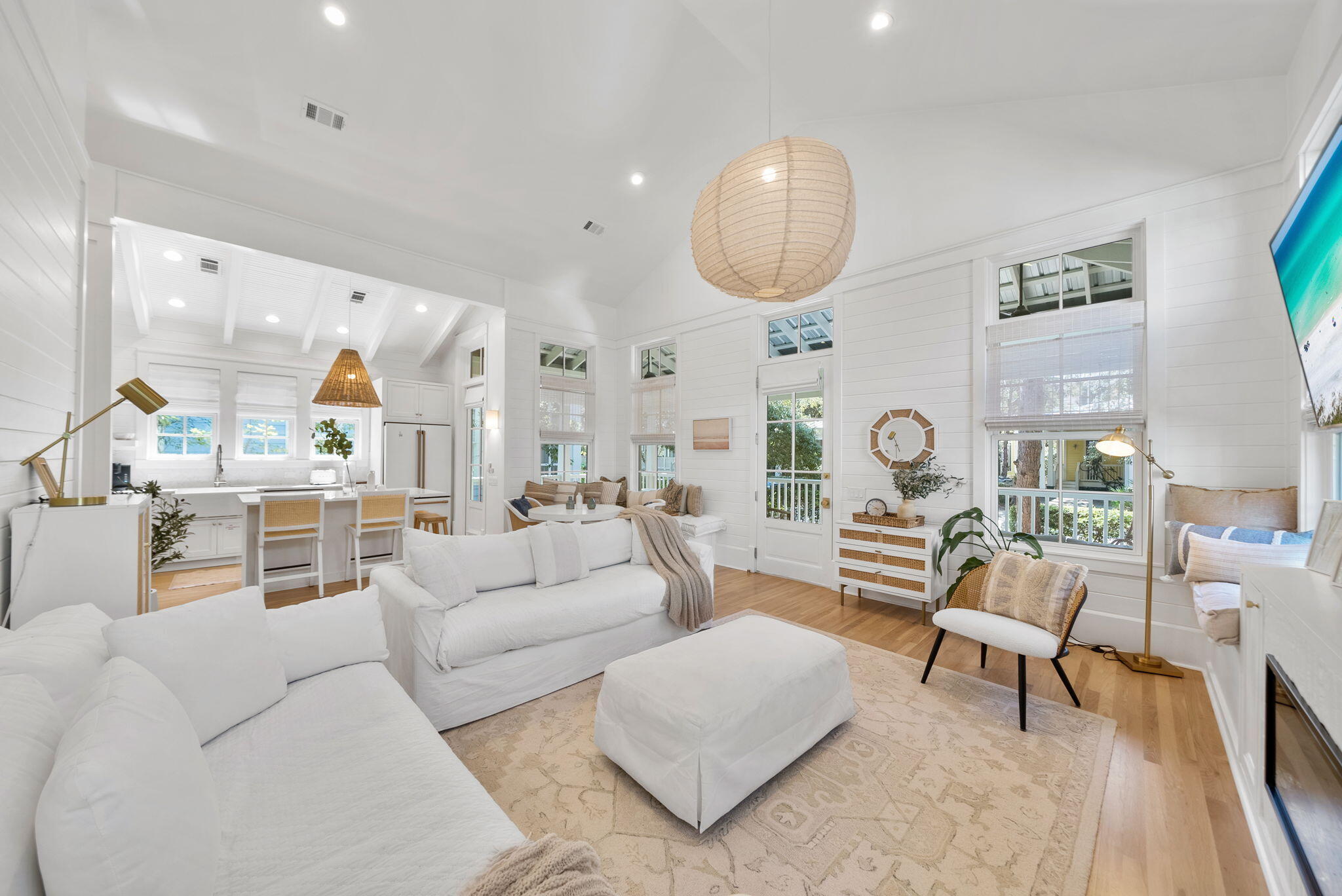 Tucked away in the heart of Phase 1 of Watercolor, this beautifully reimagined 2-bedroom, 2-bathroom cottage with an additional bunk room offers a rare opportunity to enjoy one of the community's most desirable locations. From here, you're just steps from the Watercolor Beach Club, Town Center, The Boathouse, and an easy stroll along the walking trail into Seaside. Recently renovated, the home radiates a crisp coastal feel with fresh paint, refinished floors, and stylish new furnishings inside and out. The kitchen has been thoughtfully updated with Café Series appliances, new quartz countertops and island, a new range and hood, and new shelving, all perfectly designed for both everyday living and entertaining. A cozy living room anchored by a custom fireplace and built-in cabinetry sets the tone for relaxed gatherings.

Outdoor living is just as inviting, whether it's enjoying coffee on the wraparound front porch or watching the game from the screened back porch off the primary. All bathrooms have been tastefully updated with new shower tile, flooring, and vanities. Other practical upgrades include a new roof, new tankless water heater, and ample parking for two vehicles at the rear. With room for future expansion, this cottage offers both immediate comfort and long-term potential.

Watercolor's lifestyle is unmatchedtennis courts, multiple pools, Camp Watercolor, and endless dining and shopping options are all at your doorstep. And with Seaside within walking distance, you're positioned in one of the most enviable spots along 30A.