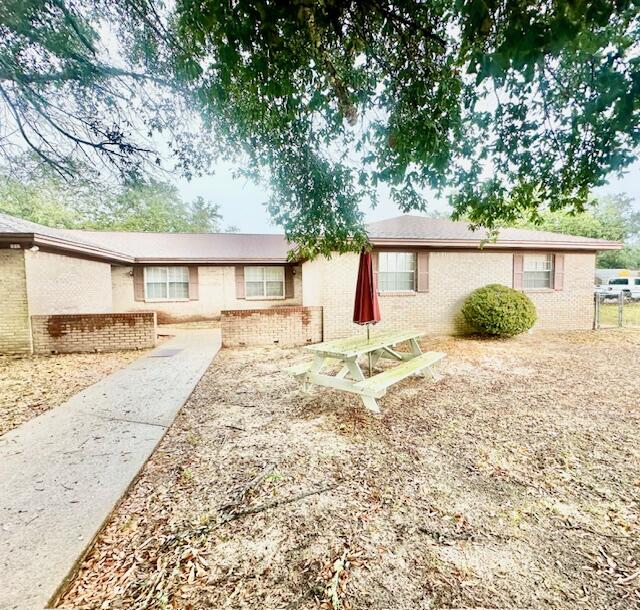 AVAILABLE: 1/28. Security deposit = $1,850 - can be broken in 2 monthly installments if qualified. 1 small pet okay w/ owner approval & a pet fee. Large unit w/ newer neutral interior paint. Kitchen has a dining area w/ all appliances in place, lots of cabinetry & washer & dryer hook ups. Tile & carpet flooring throughout. All electric! Screened patio great for relaxing/entertaining. Large corner lot with yard building! Chain link fenced yard & 2 car covered carport plus a covered front entrance. Desirable Niceville location. Welcome home!