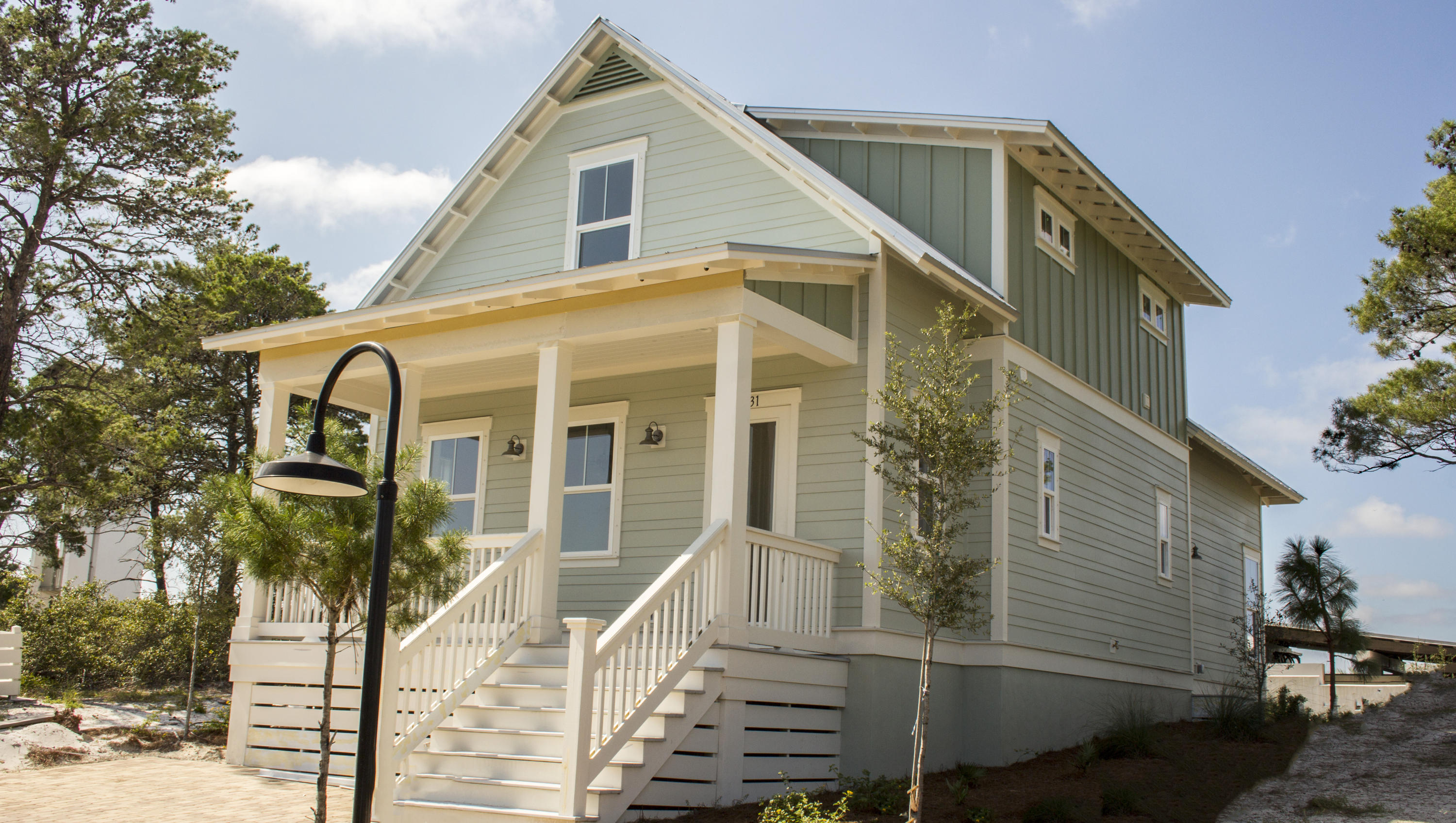 The Seaside Plan features the master bedroom on the first floor, stainless steel appliances, granite countertops, tile in bathrooms and laundry, hardwood on main level, stairs, and landing area. Also, included is a tankless hot water heater, metal roof and built in pest control system.