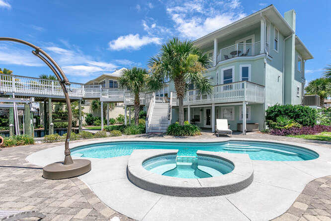 Anglers Avenue is a newly renovated boaters paradise and just 2 blocks from the beaches of Holiday Isle.
Anglers Avenue boasts 90ft of water frontage on the canal with two 40ft inland boat slips one is covered. There is a 20,000lb lift in one and a pontoon lift in the covered slip. The inground pool and entertainment area complete the back yard. Enjoy harbor and sunset view from the second floor deck extending over the covered boat slip. The master bedroom encompasses the entire 3rd floor offering sweeping views of the harbor and canals. The 2nd floor offers a living room, a kitchen, and 2 bedrooms. The lower floor has two bedrooms another living room opening up to the pool area and harbor life.  Great place to relax after boating and fishing.  Bring your boat and enjoy the easy ride out of the Harbor and through the Destin Pass into the gorgeous Gulf of Mexico.  Destin offers some of the best fishing and boating! Anglers Avenue offers an amazing opportunity to have a home on Holiday Isle!