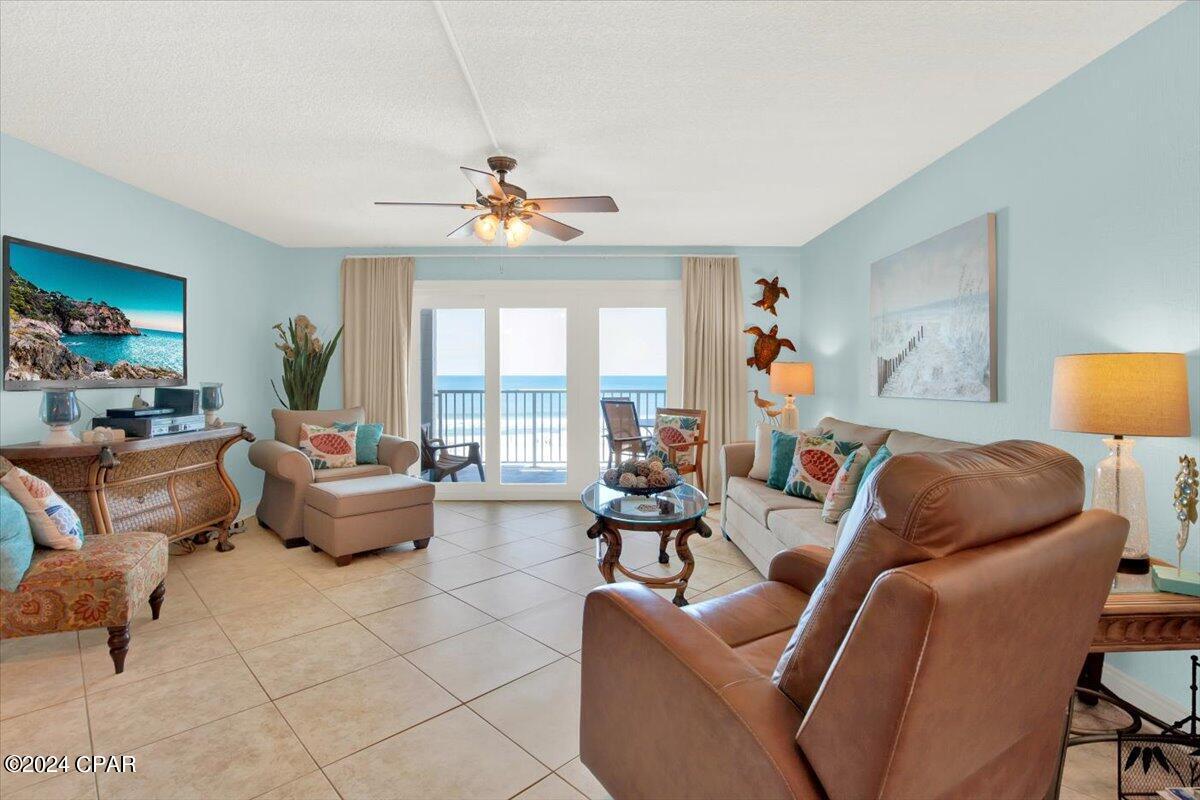 Welcome to your charming one-bedroom unit, nestled within the coveted, serene enclave of Mariner West, a low-density mid-rise condo development. Step into the inviting living space, where expansive windows frame breathtaking vistas of the Gulf of Mexico's pristine white sands and shimmering emerald waters. Delight in the unparalleled beauty of sunsets from your private balcony, serenaded by the gentle rhythm of waves lapping against the shore. Inside, discover a seamless blend of style and functionality, with tiled flooring enhancing the kitchen, living, and bathroom areas, while plush carpeting adorns the bedroom for cozy comfort. The kitchen is a culinary haven, boasting elegant granite countertops, a tasteful stone tile backsplash, rich cherry cabinets,  and modern white appliances. Throughout the condo, a tranquil coastal blue palette creates an atmosphere of relaxation and serenity. Indulge in luxury within the master bathroom, featuring a tiled shower enclosed by sleek glass doors, complemented by granite vanities in both bathrooms. Outside, Mariner West offers resort-style