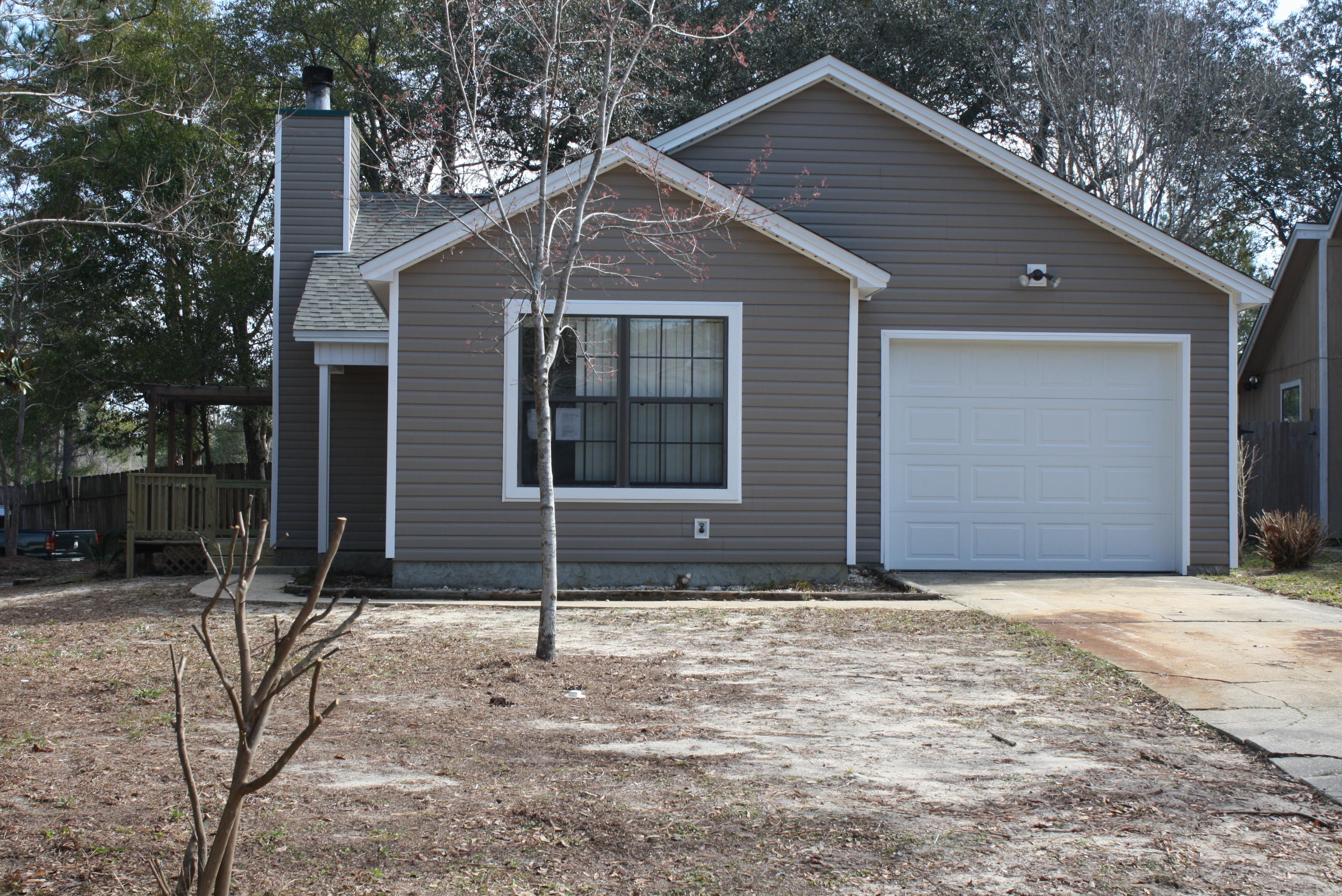 Located conveniently to Eglin AFB! Newly renovated 3 bedroom, 2 full bath home! Even the roof and HVAC unit are brand new! This home is situated on a large corner lot to allow a spacious backyard and even features a deck for your enjoyment! Inside the home you will fall in love with open floor plan with vaulted ceilings, updated kitchen (appliances include fridge, dishwasher, and stove/oven), fireplace, wood laminate floors and newly painted walls and trim. The three bedrooms are split floor plan and all have ceiling fans and hardwood laminate flooring. The master bedroom features a full master bath in suite. There is an attached one car garage with attic stairs for additional storage. You won't want to miss this one!